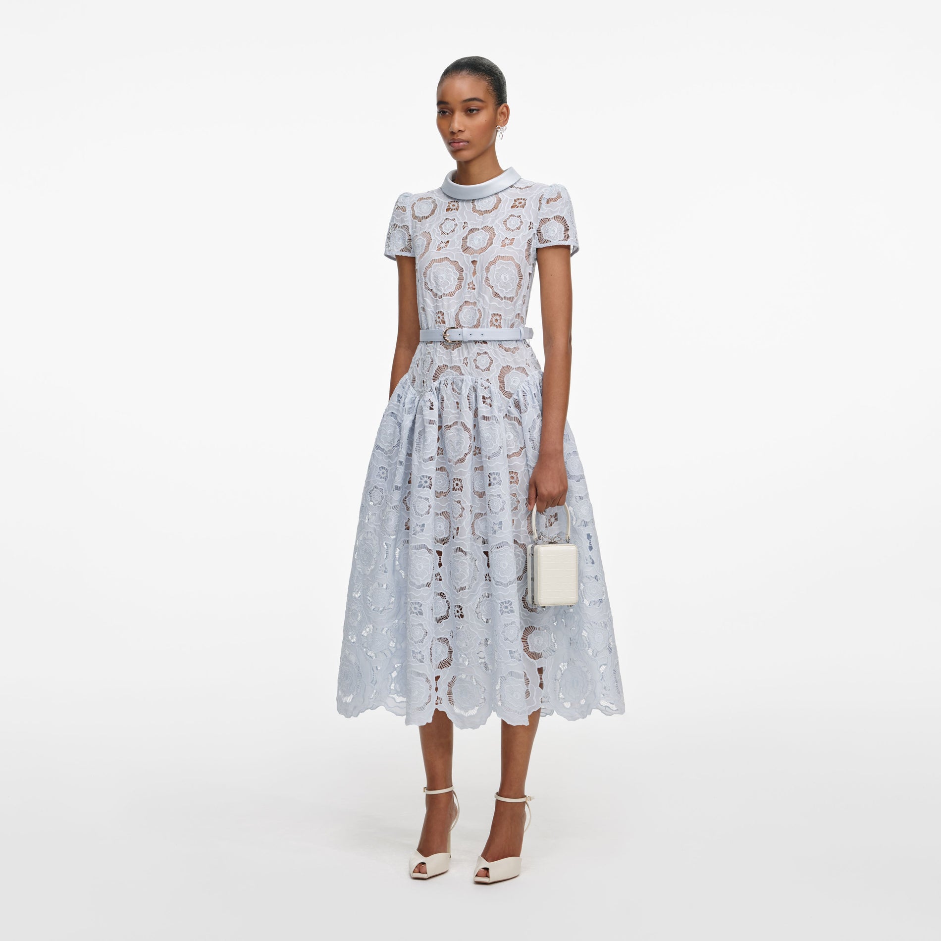 Side view of a woman wearing the Blue Floral Lace Midi Dress
