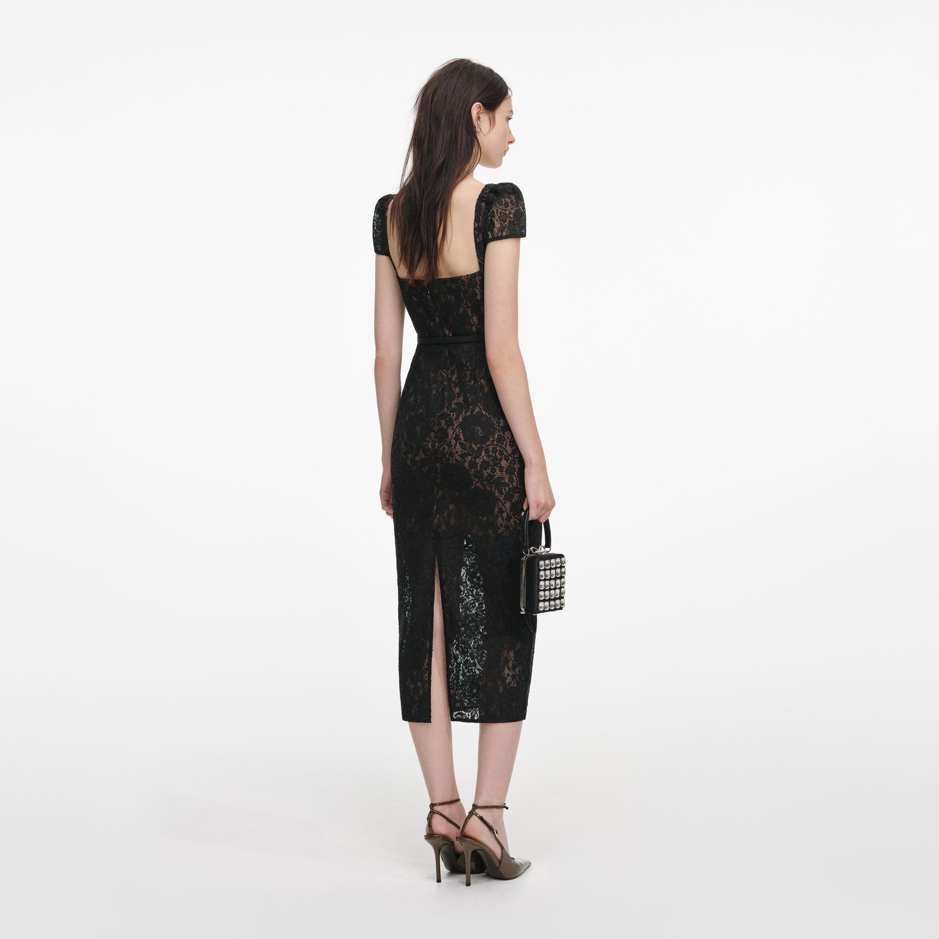 Back view of a woman wearing the Black Sweetheart Lace Midi Dress