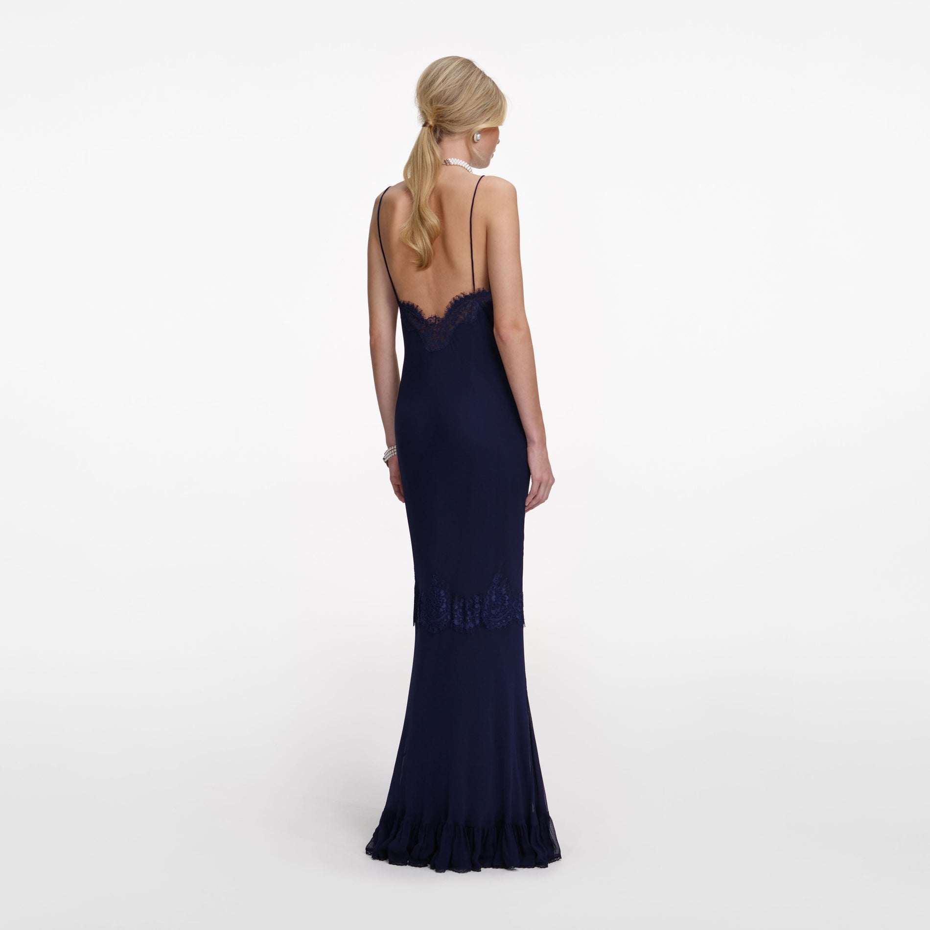 Back view of a woman wearing the Navy Lace Georgette Maxi Dress