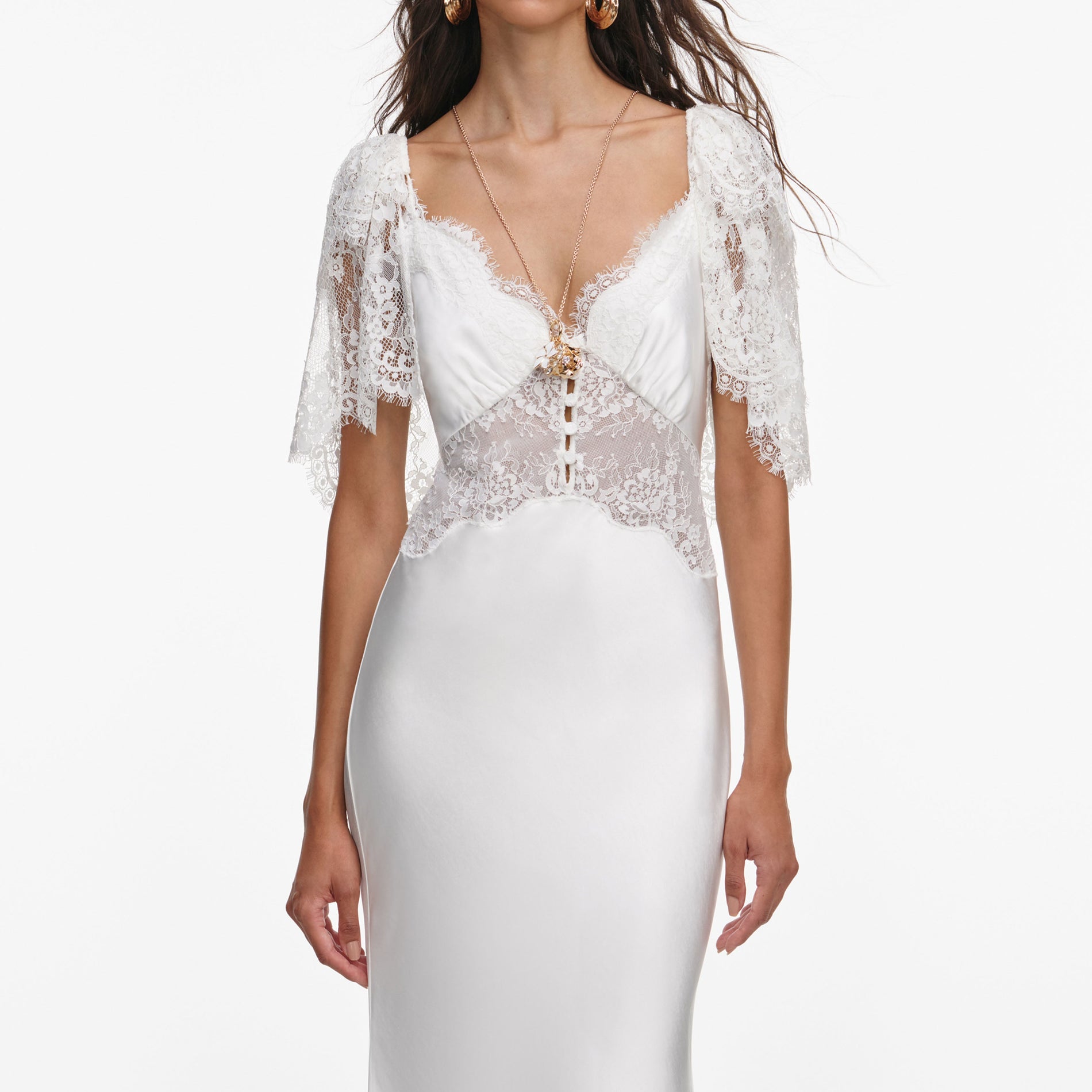 A close up of a woman wearing the White Fine Lace Satin Maxi Dress