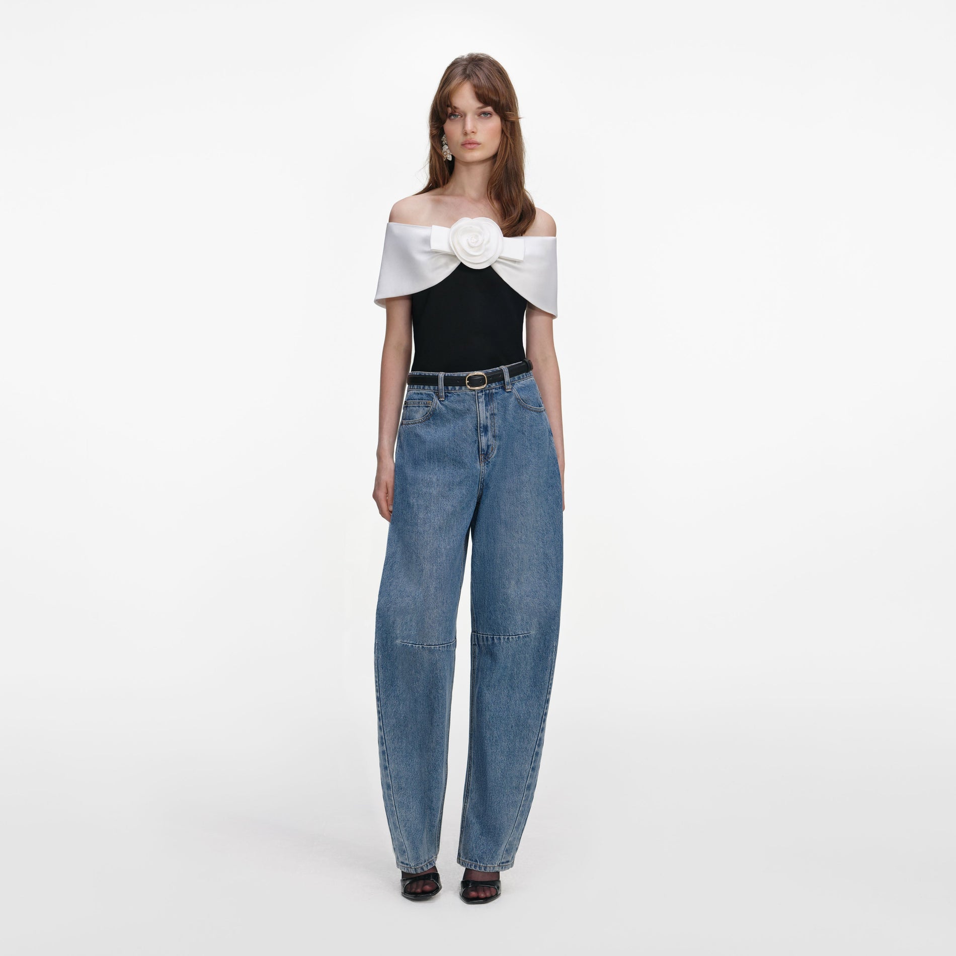 Front view of a woman wearing the Black Crepe Flower Top