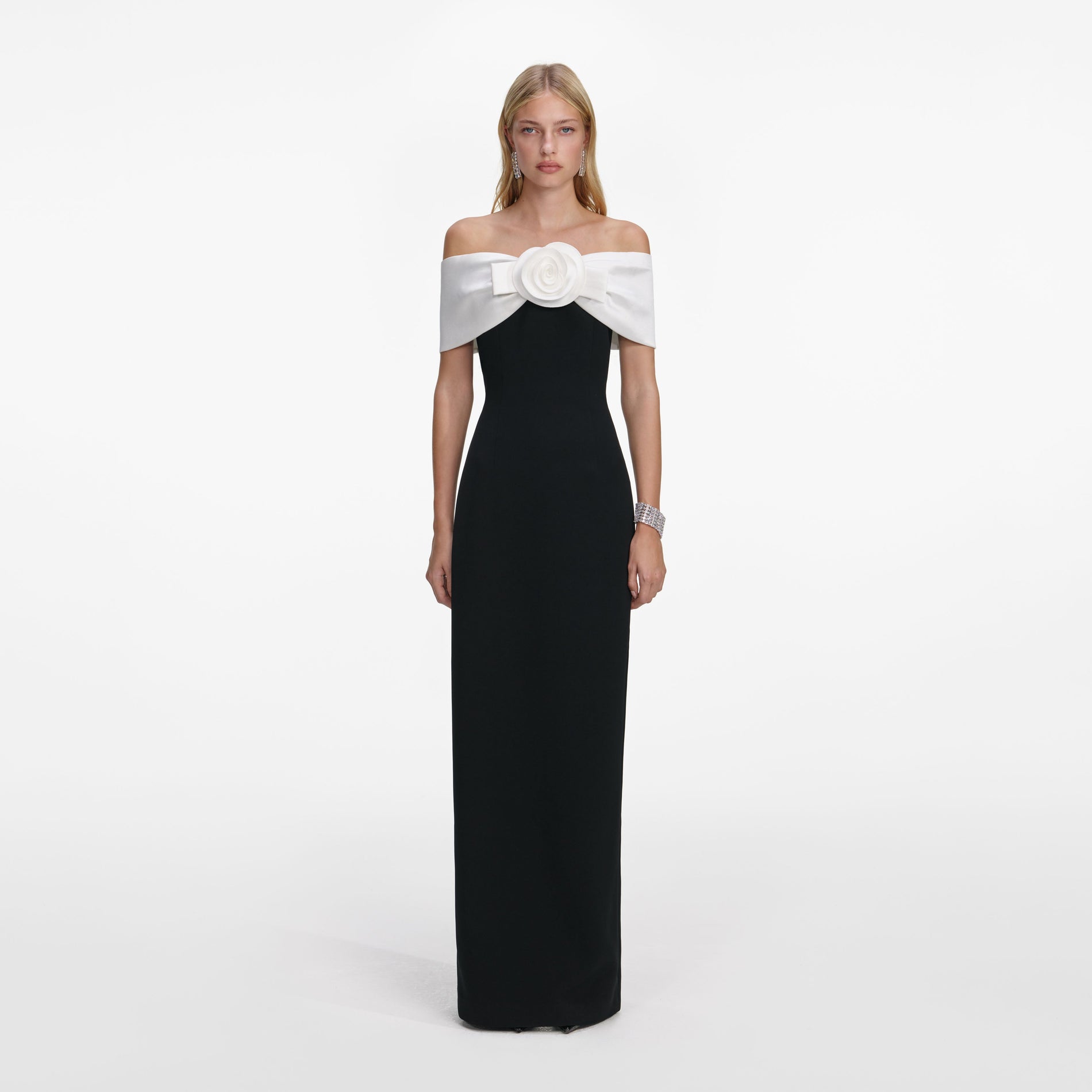 Front view of a woman wearing the Black Crepe Flower Maxi Dress