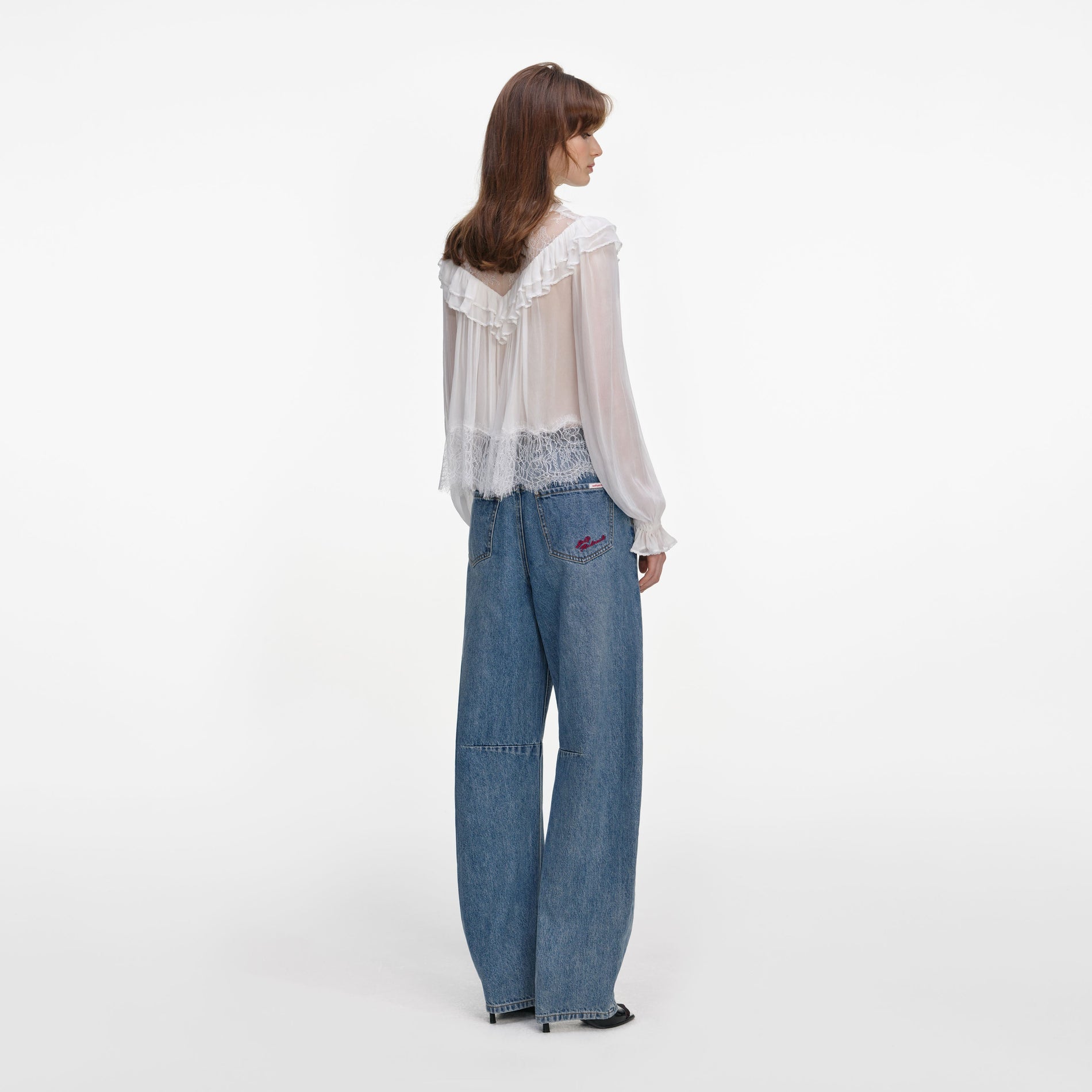 Back view of a woman wearing the White Georgette Lace Blouse