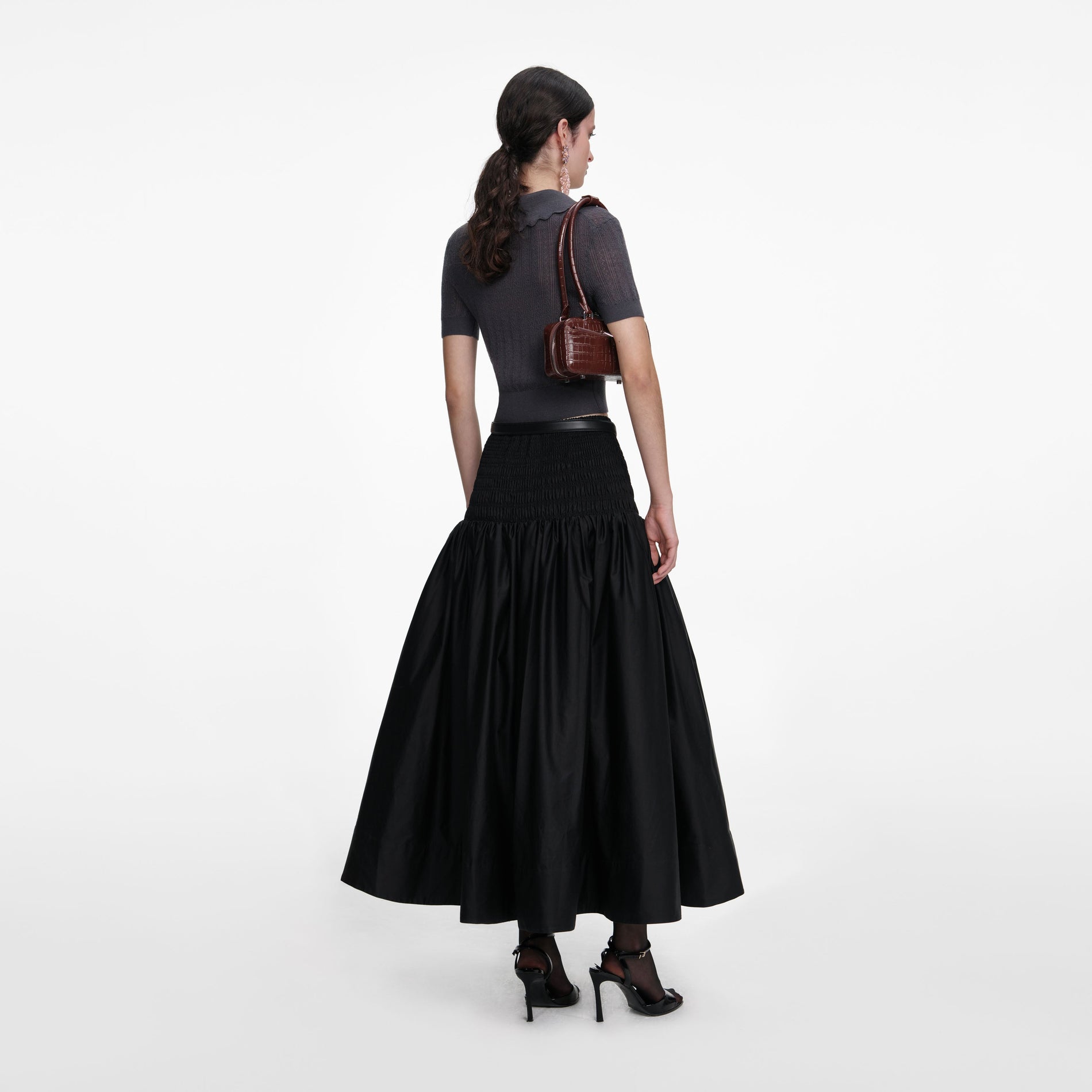 Back view of a woman wearing the Grey Embroidered Pointelle Knit Top