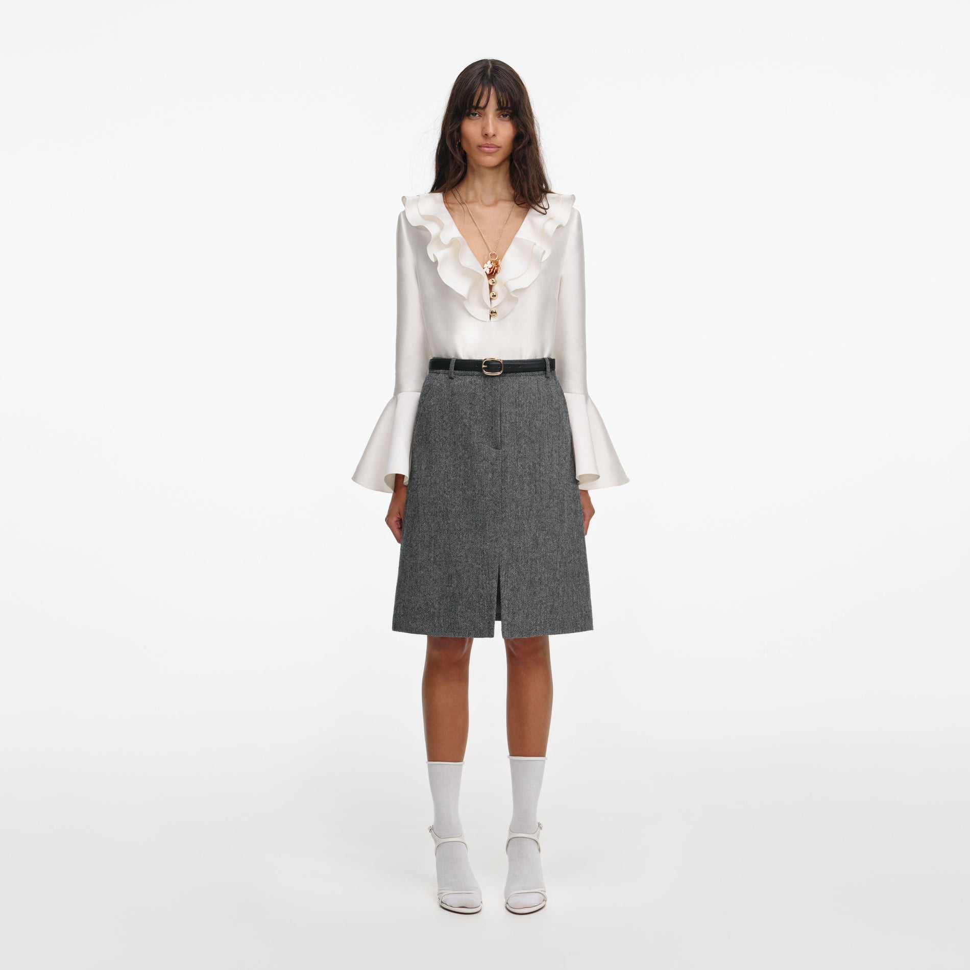Front view of a woman wearing the Cream Taffeta Ruffle Top