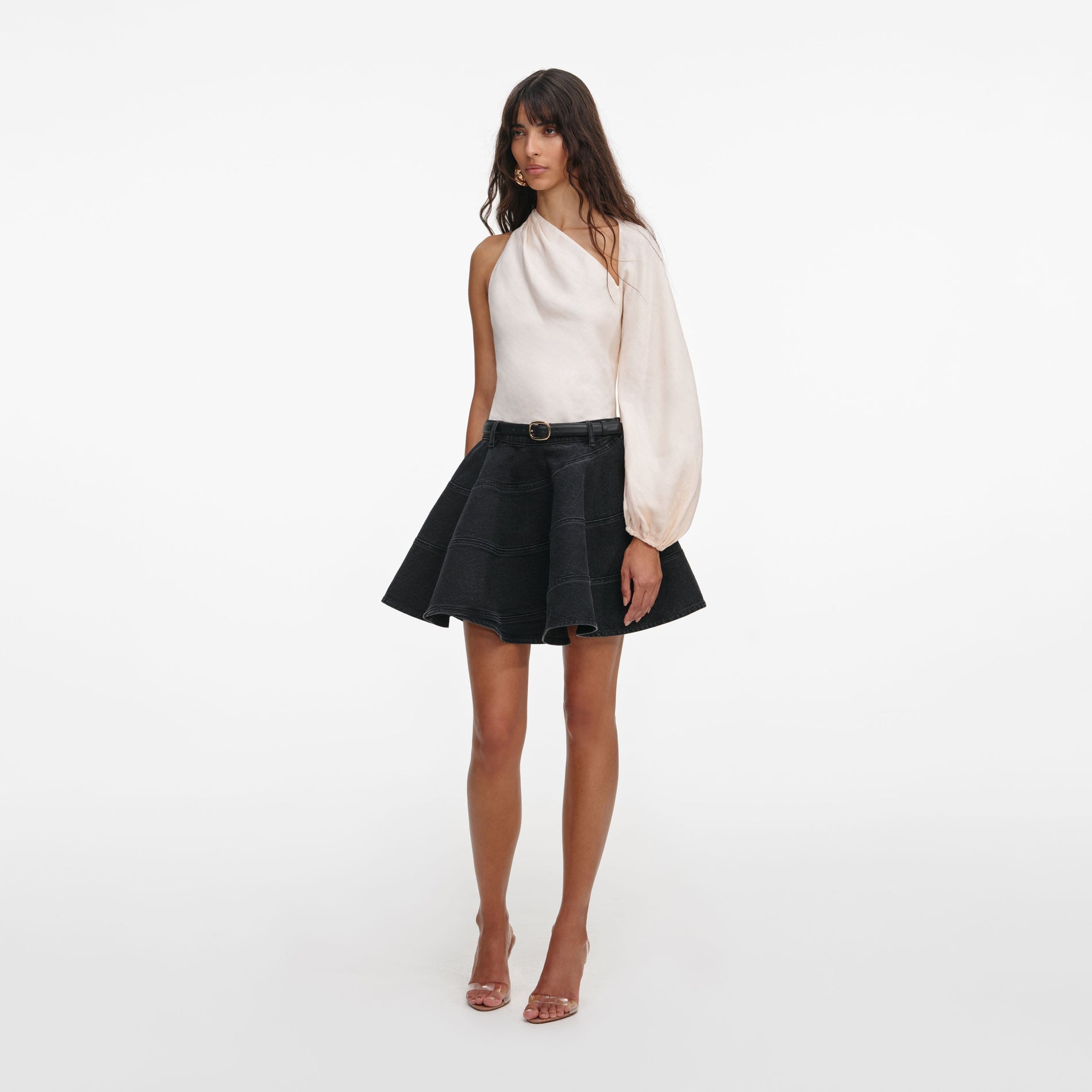 Side view of a woman wearing the Cream Draped Sleeve Top