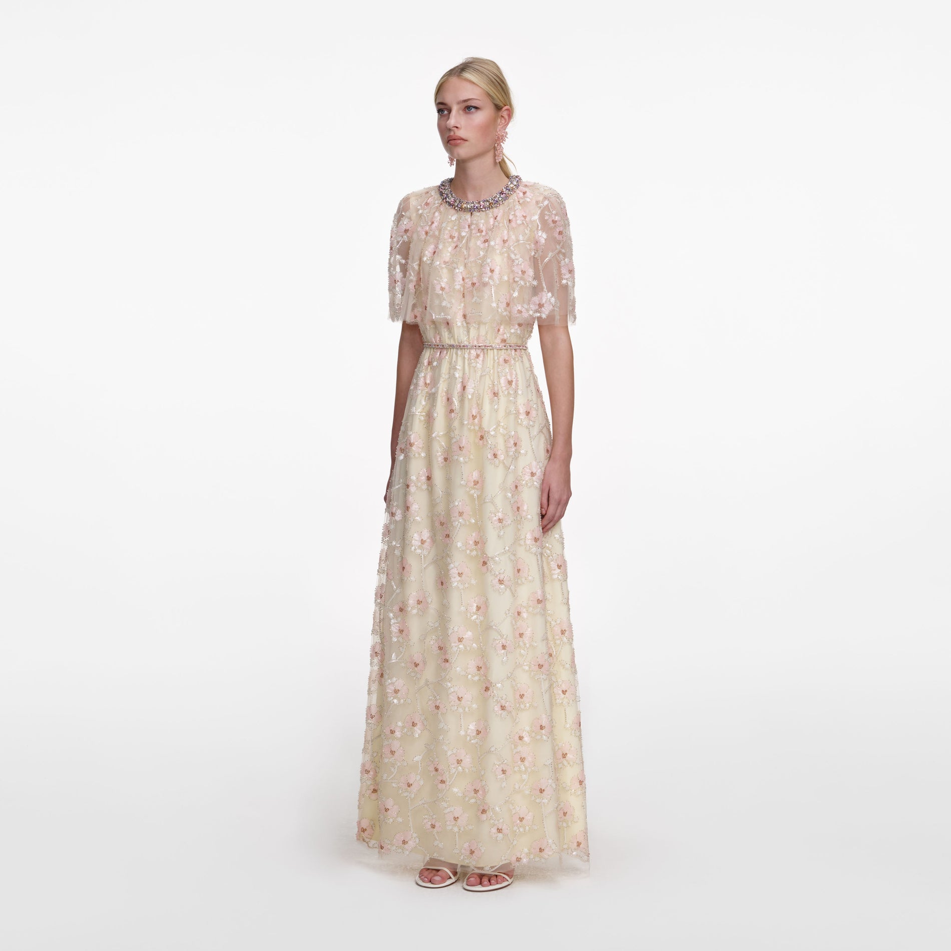Side view of a woman wearing the Champagne Floral Embellished Maxi Dress