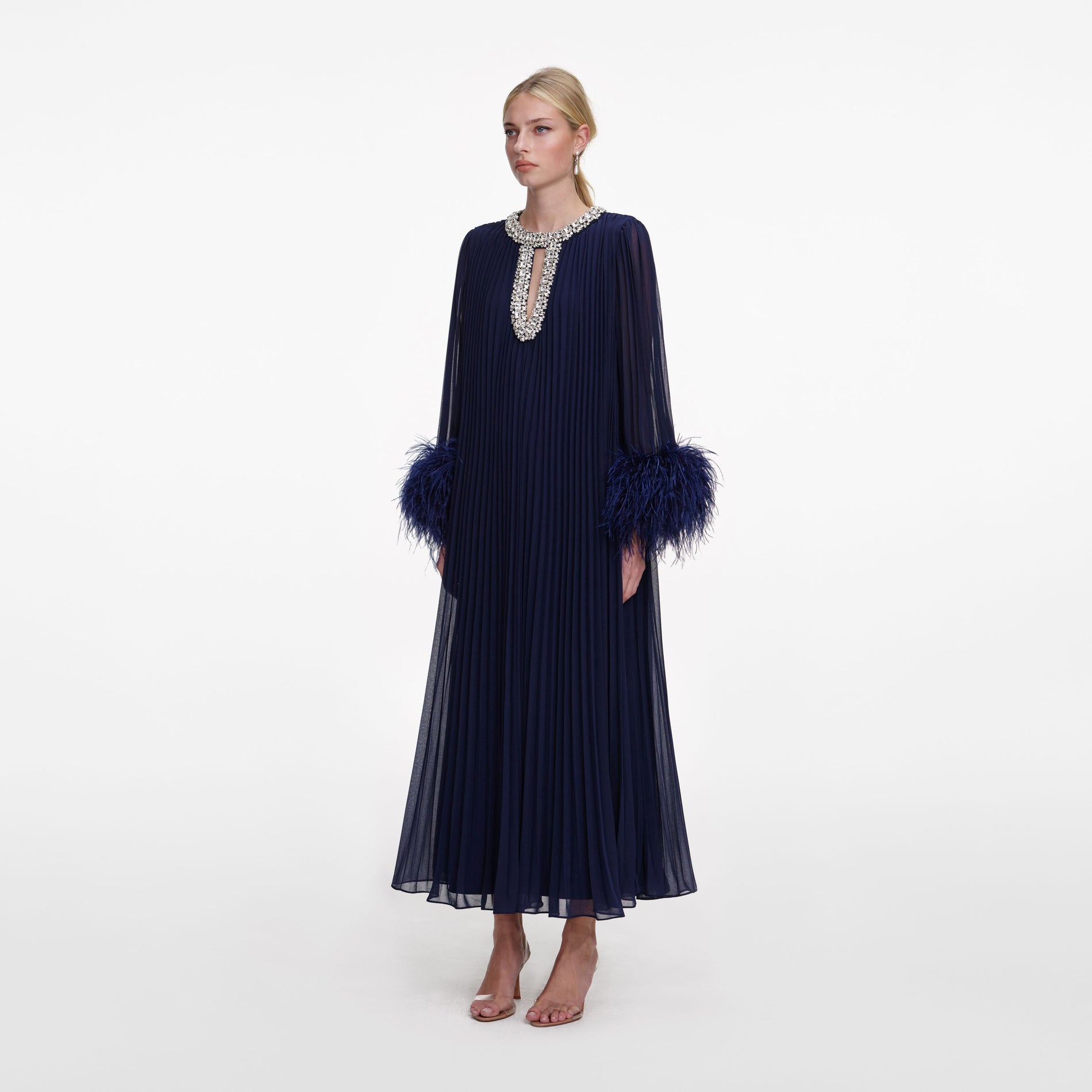 Side view of a woman wearing the Navy Chiffon Feather Midi Dress