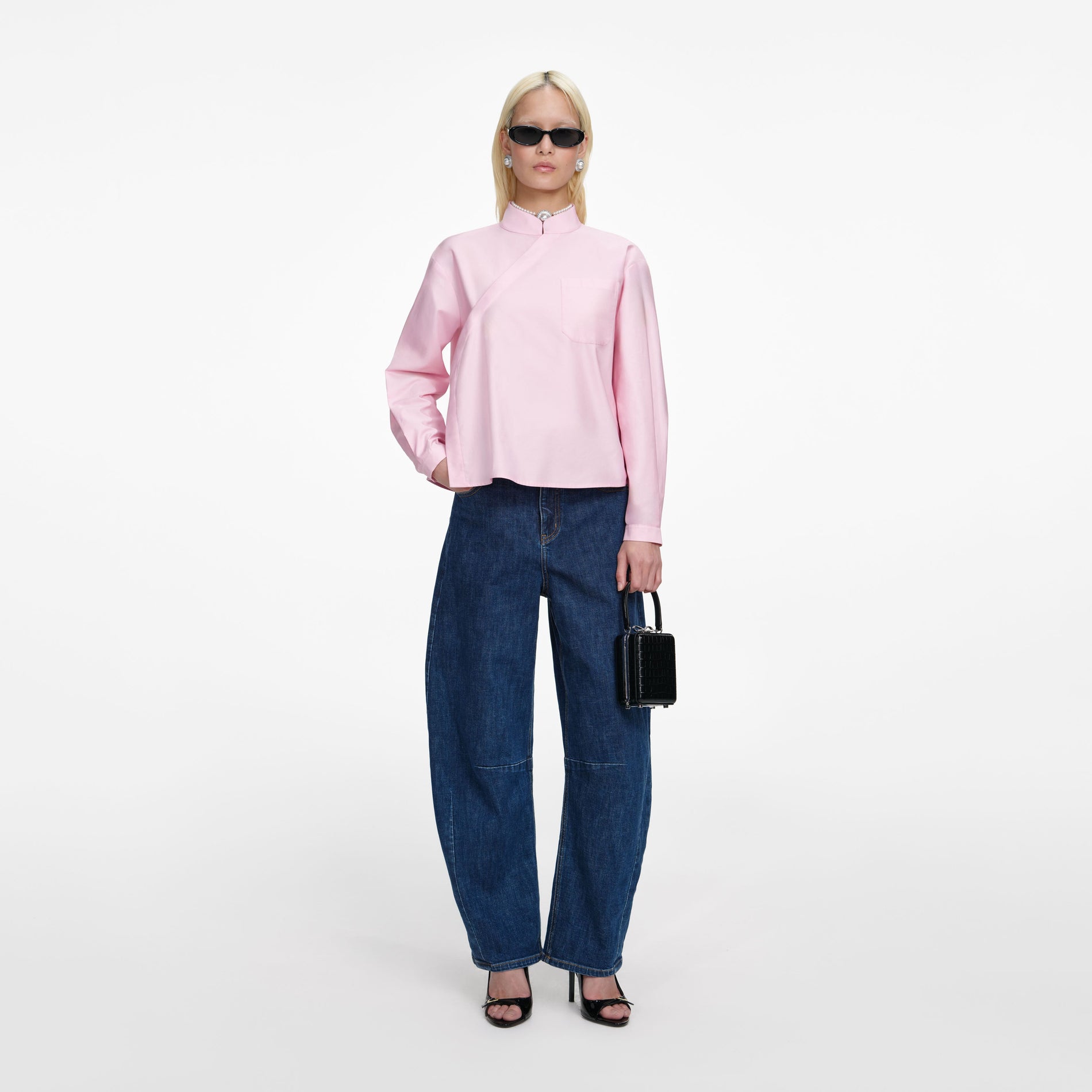 Front view of a woman wearing the Pink Cotton Asymmetric Shirt