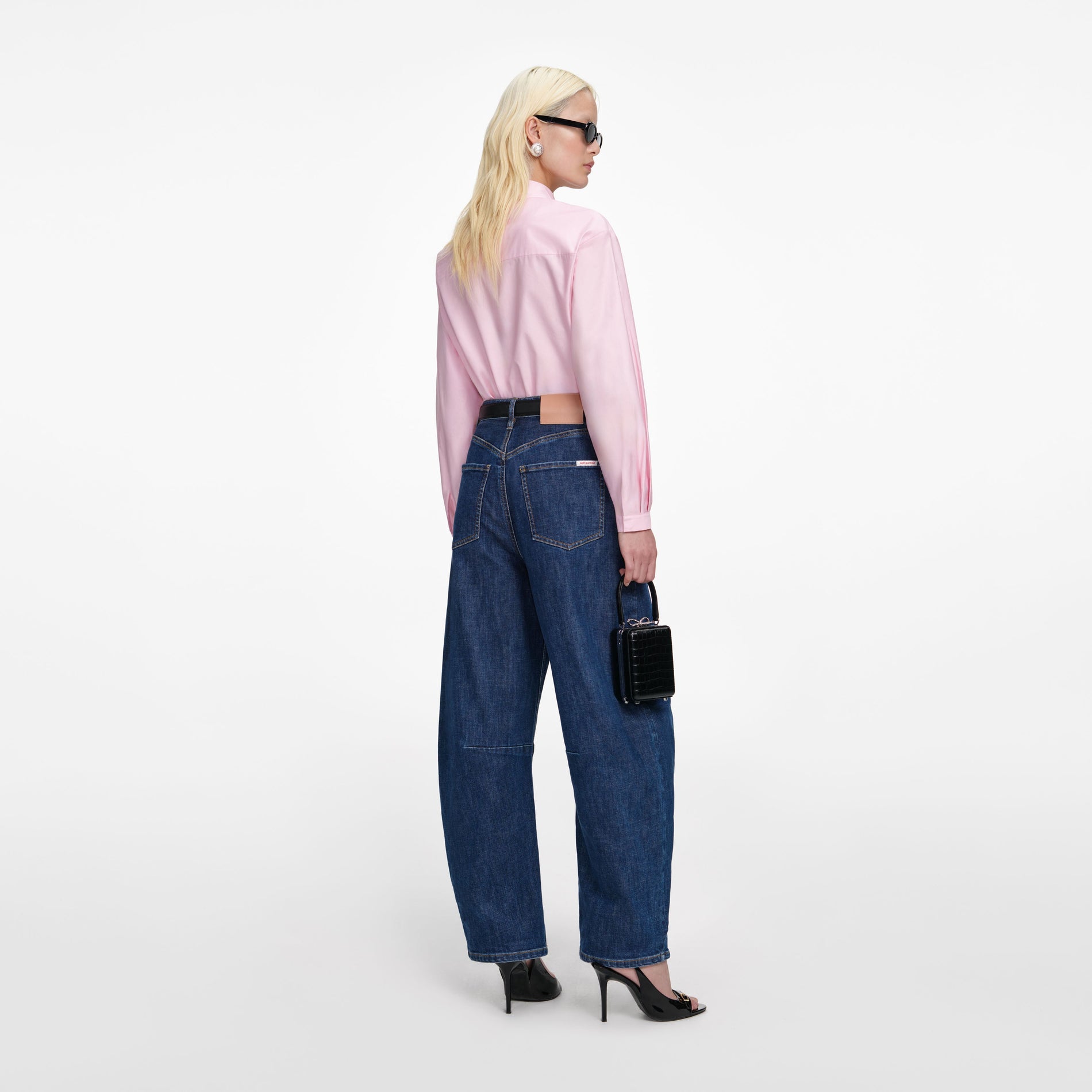 Back view of a woman wearing the Pink Cotton Asymmetric Shirt
