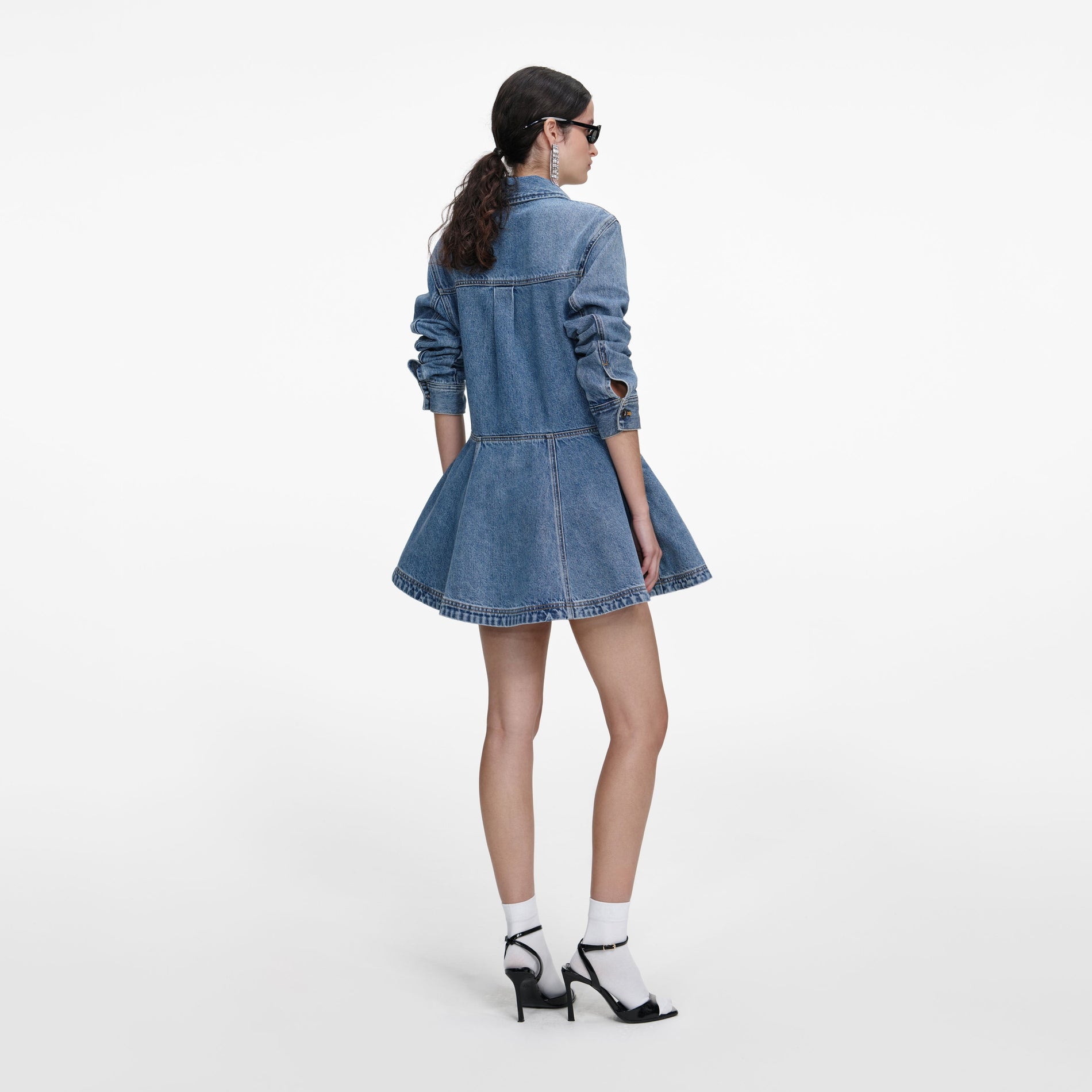 Back view of a woman wearing the Denim Mini Shirt Dress