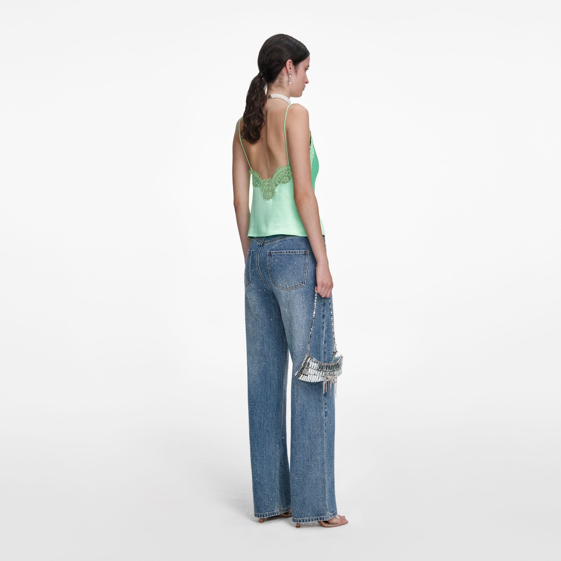 Back view of a woman wearing the Rhinestone Denim Straight Leg Jeans