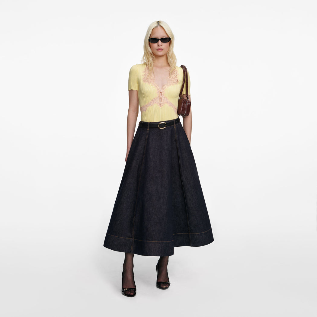 Front view of a woman wearing the Indigo Denim Flared Midi Skirt