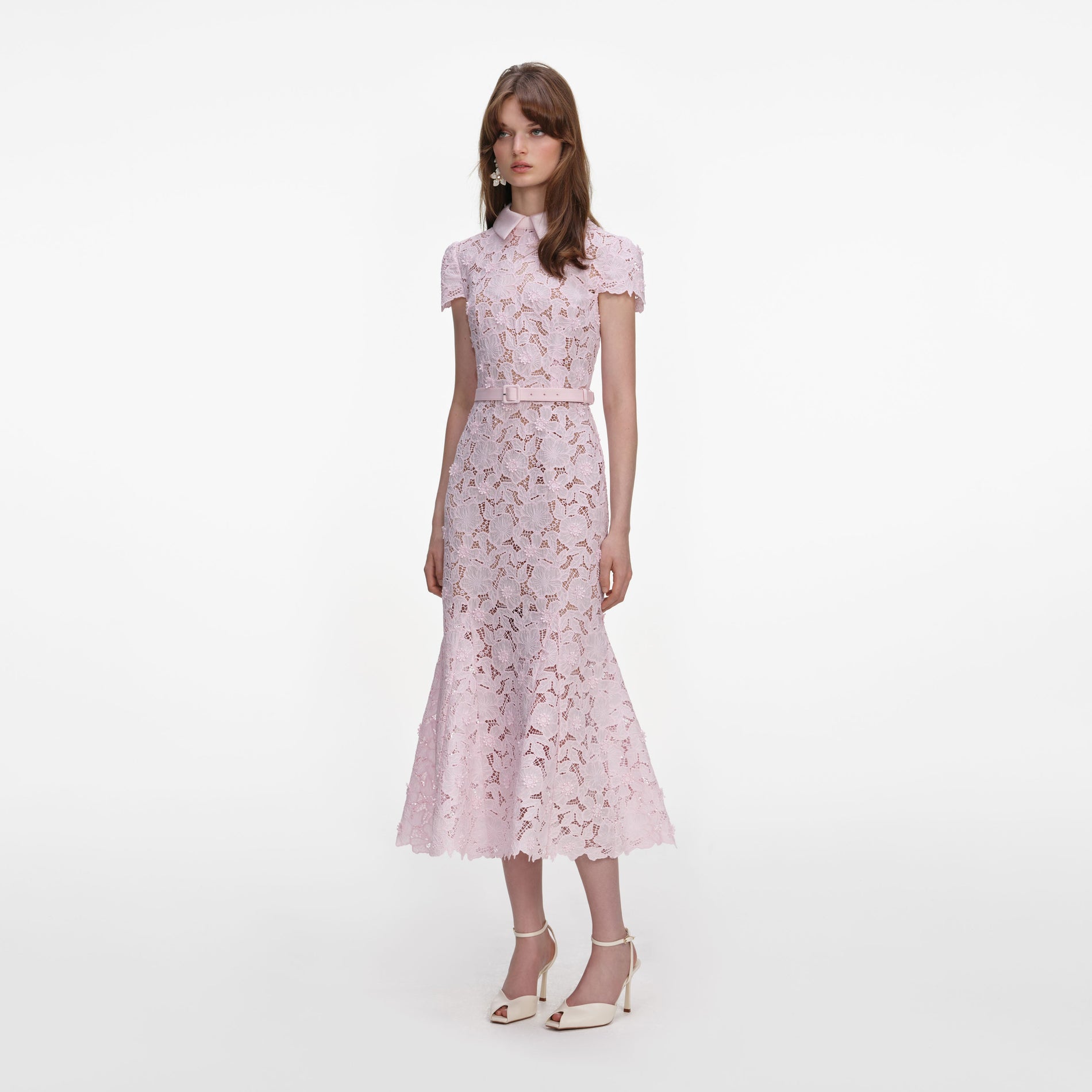 Side view of a woman wearing the Pink Guipure Lace Midi Dress