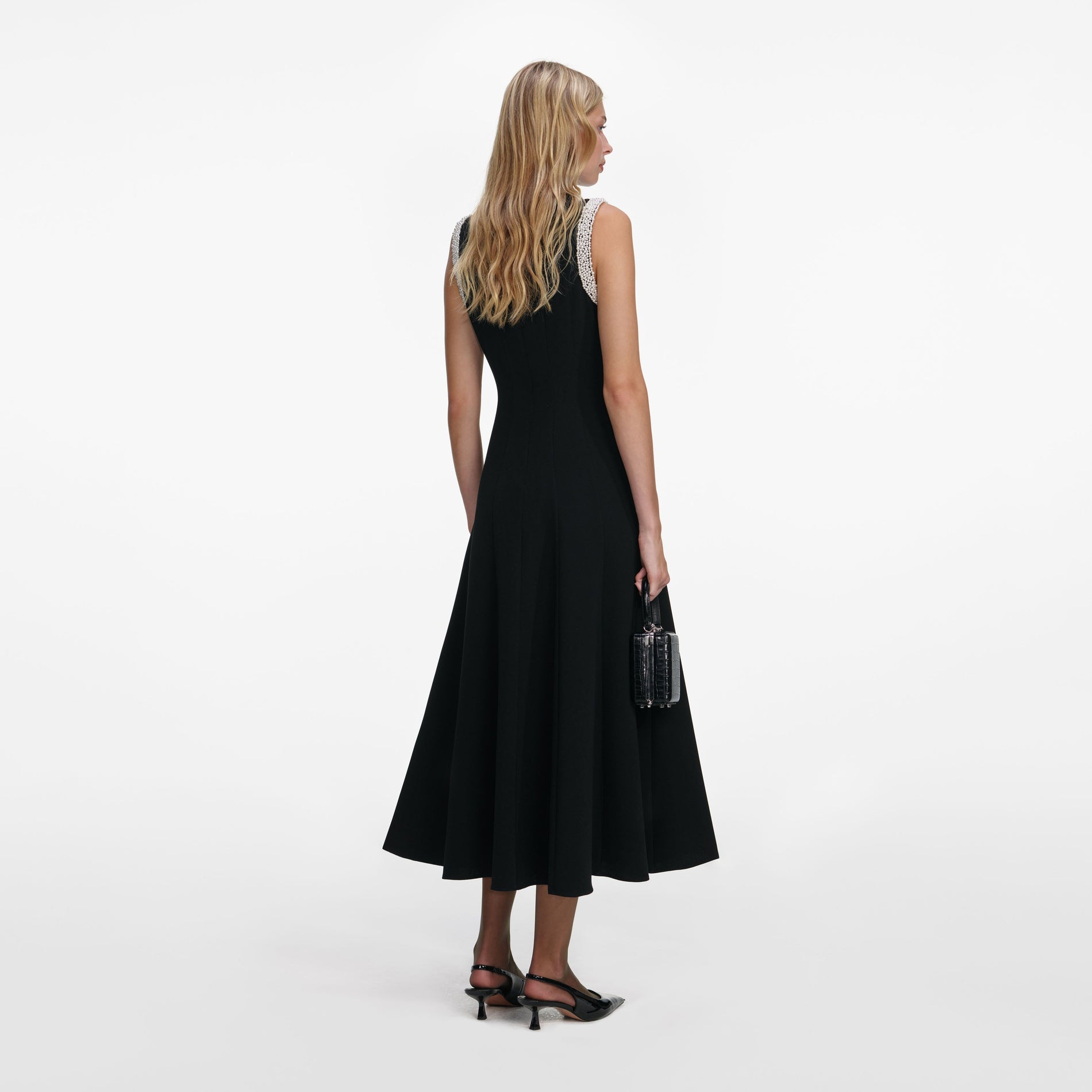 Back view of a woman wearing the Black Crepe Pearl Trim Midi Dress