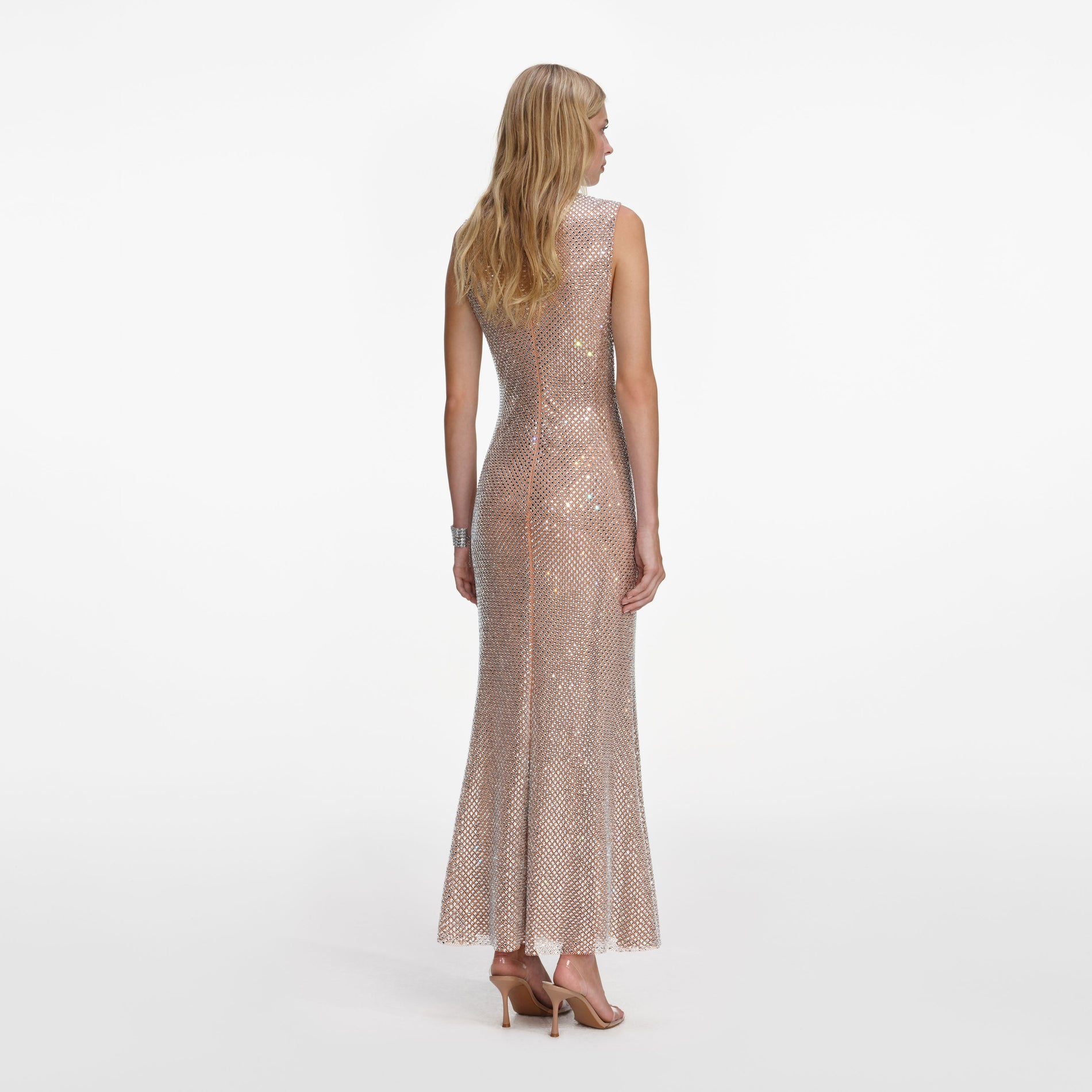 Back view of a woman wearing the Silver Rhinestone Mesh Midi Dress