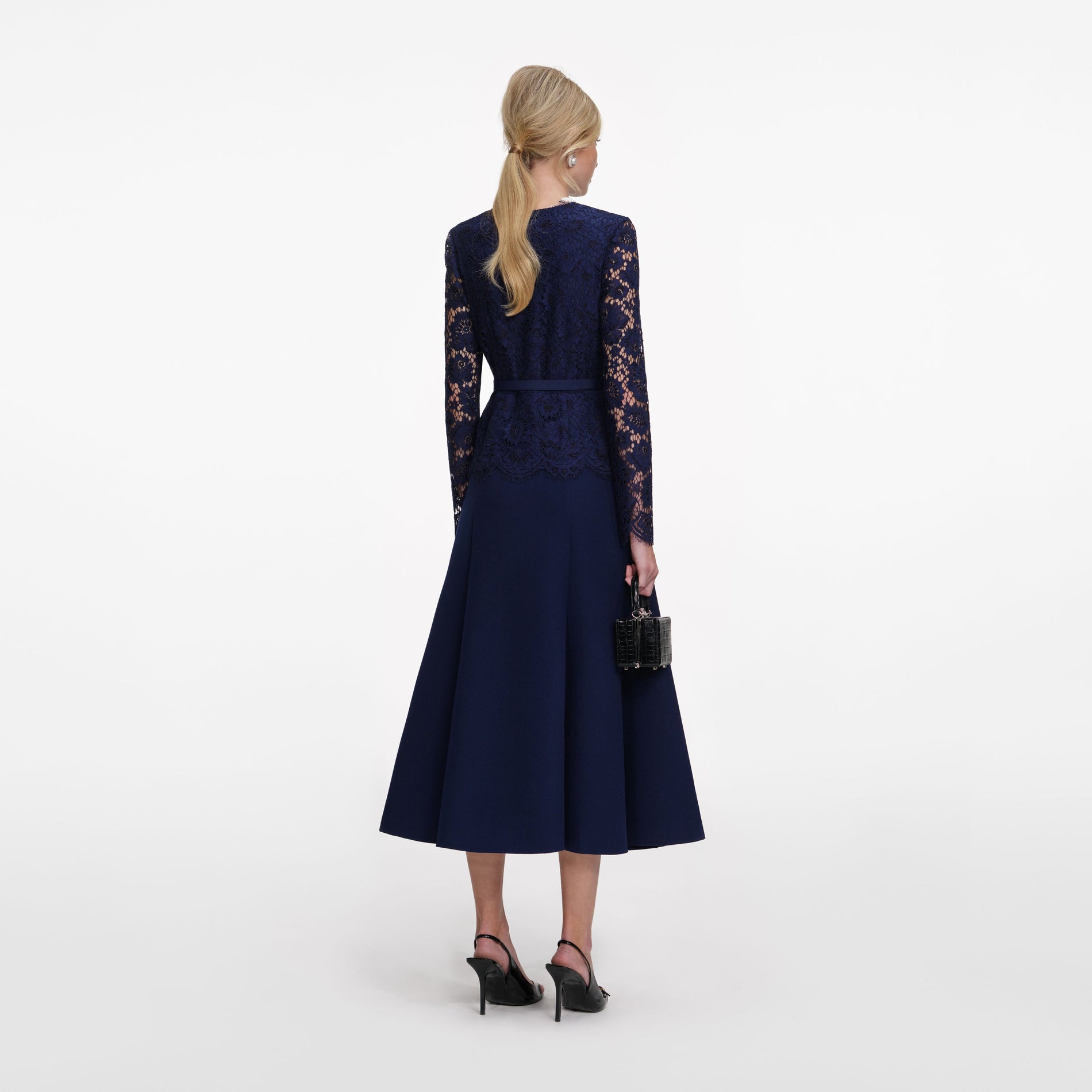Back view of a woman wearing the Navy Tailored Lace Midi Dress