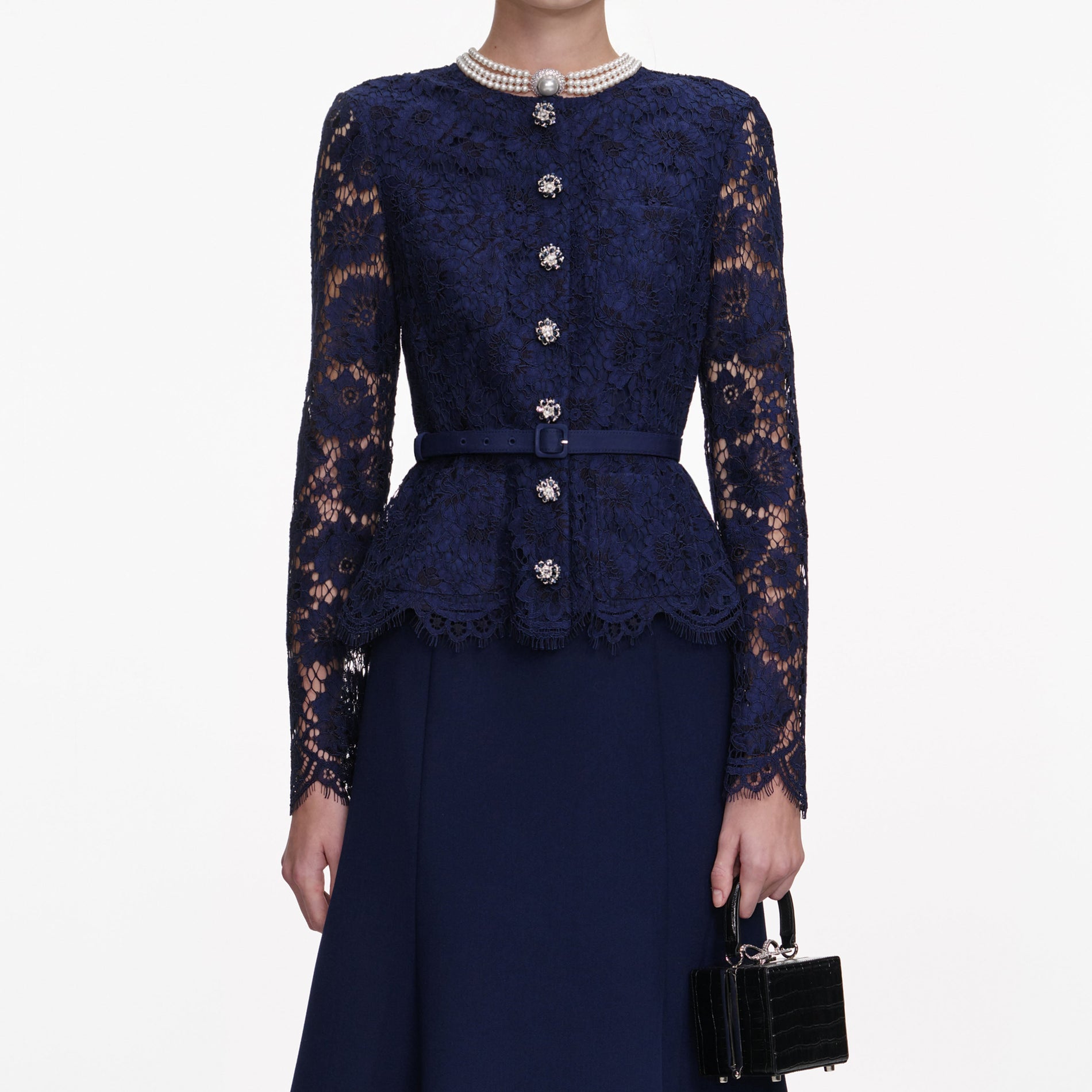 A close up of a woman wearing the Navy Tailored Lace Midi Dress