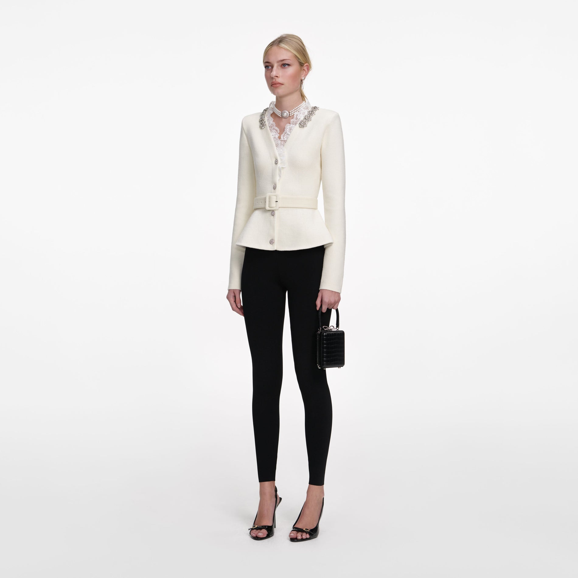 Side view of a woman wearing the Cream Crystal Trim Cardigan