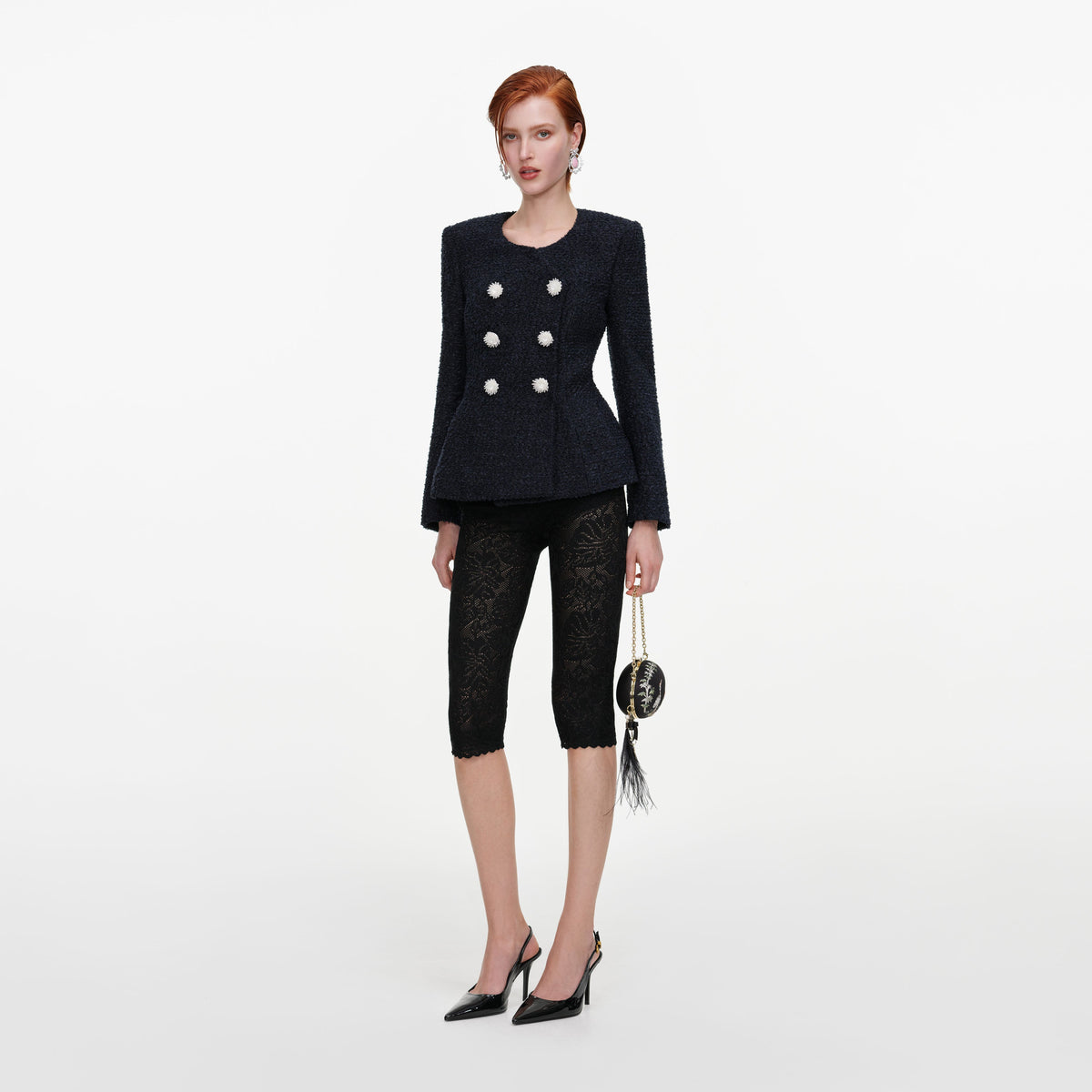 Side view of a woman wearing the Navy Boucle Jacket