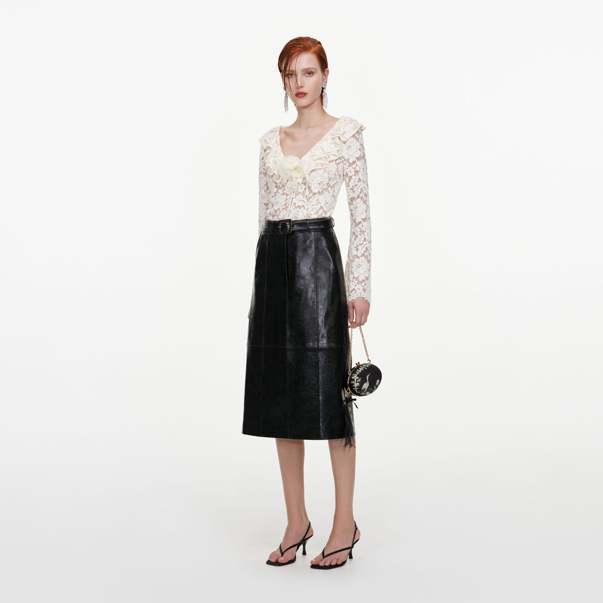Side view of a woman wearing the Cream Lace Frill Top
