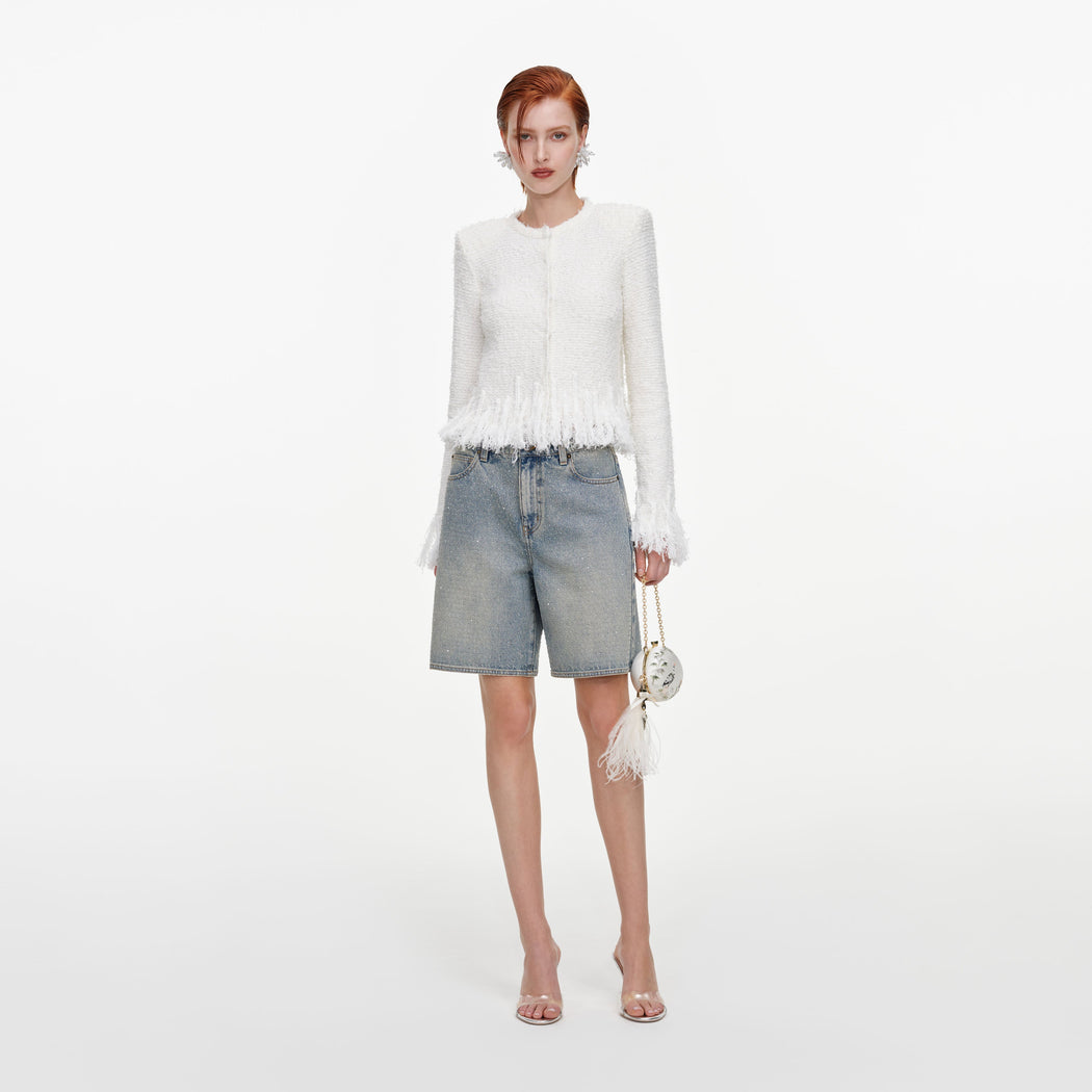Front view of a woman wearing the White Fringe Knit Cardigan