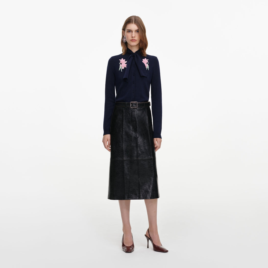 Front view of a woman wearing the Navy Sequin Embellished Knit Cardigan