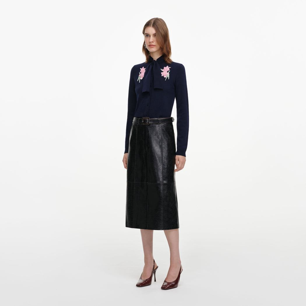 Side view of a woman wearing the Navy Sequin Embellished Knit Cardigan