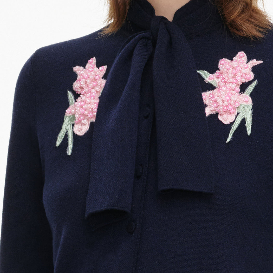 A close up of the fabric for the Navy Sequin Embellished Knit Cardigan