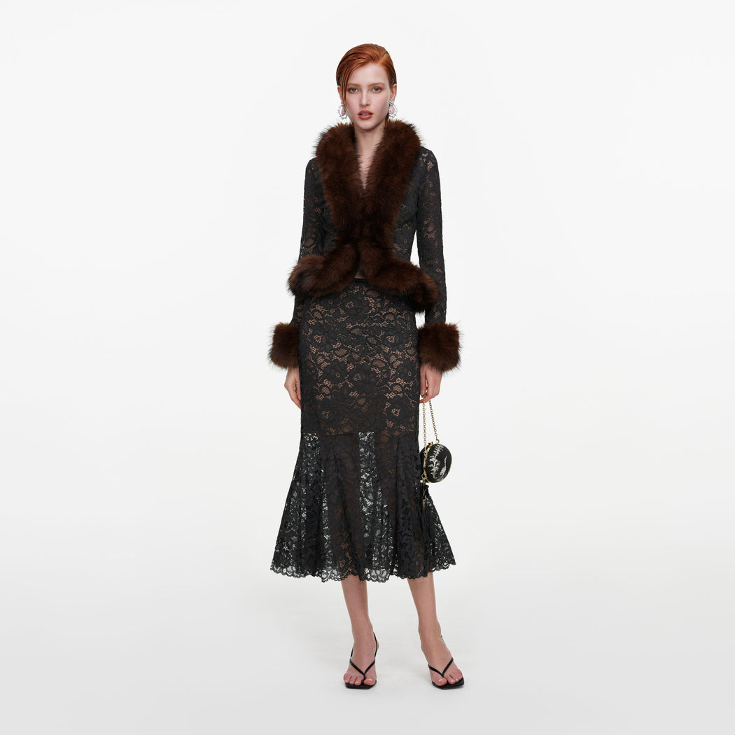 Front view of a woman wearing the Grey Lace Midi Skirt