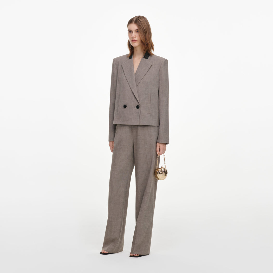 Side view of a woman wearing the Brown Twill Double Breasted Jacket