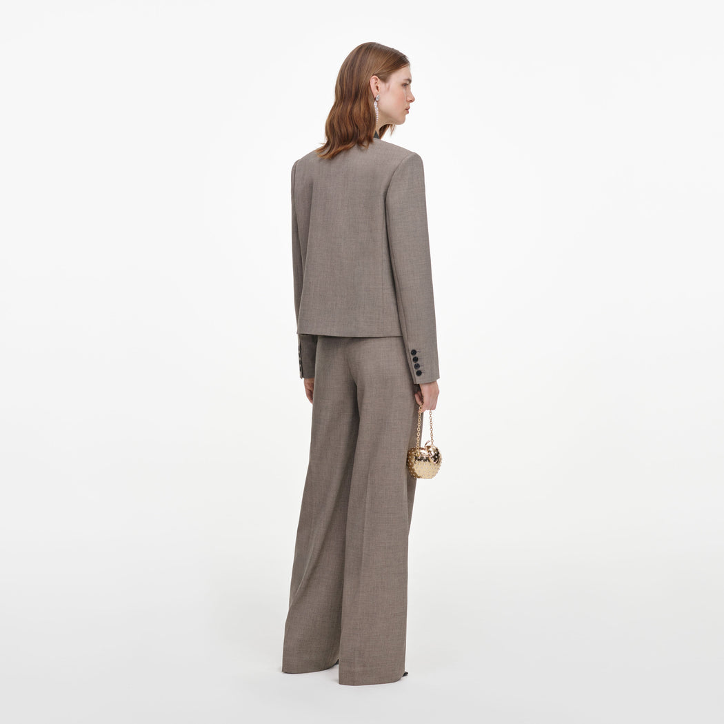 Back view of a woman wearing the Brown Twill Double Breasted Jacket
