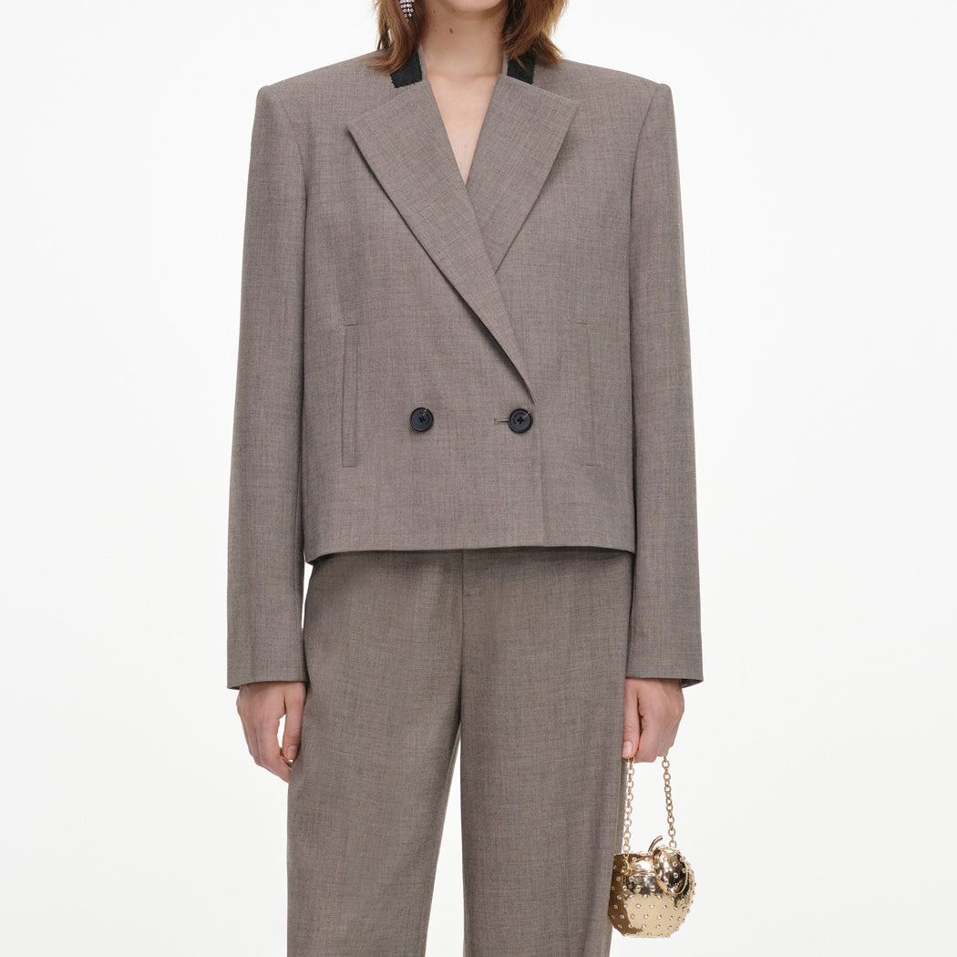 A close up of a woman wearing the Brown Twill Double Breasted Jacket