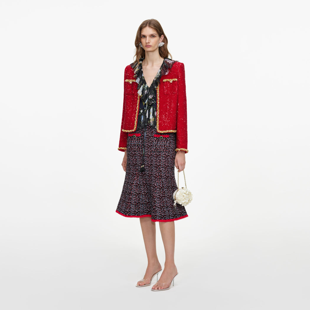 Side view of a woman wearing the Red Sequin Jacket