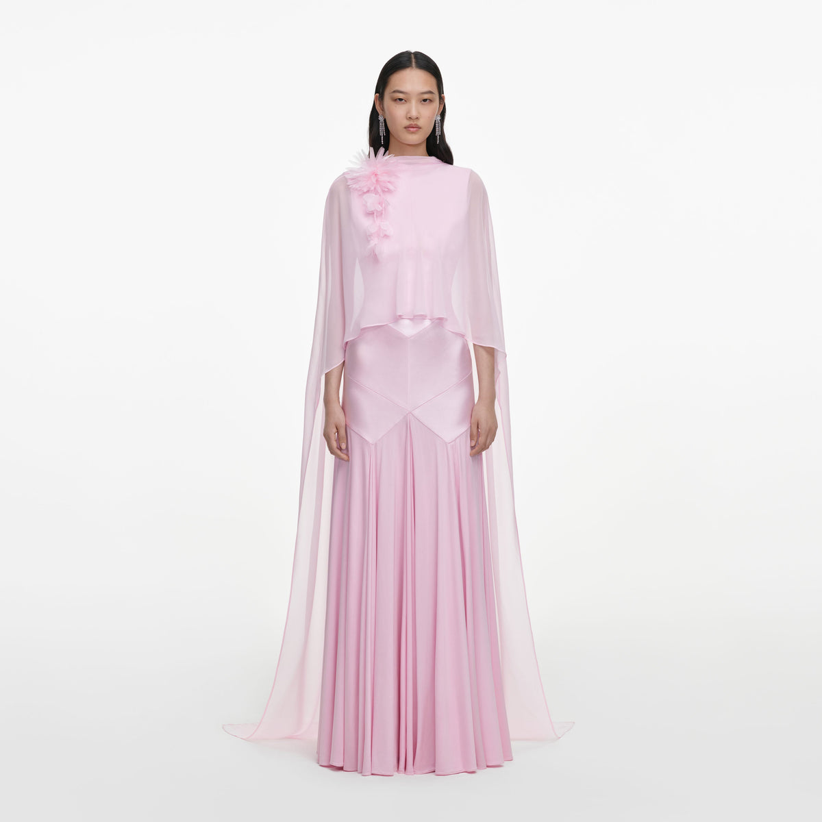 Front view of a woman wearing the Pink Satin Jersey Cape Maxi Dress