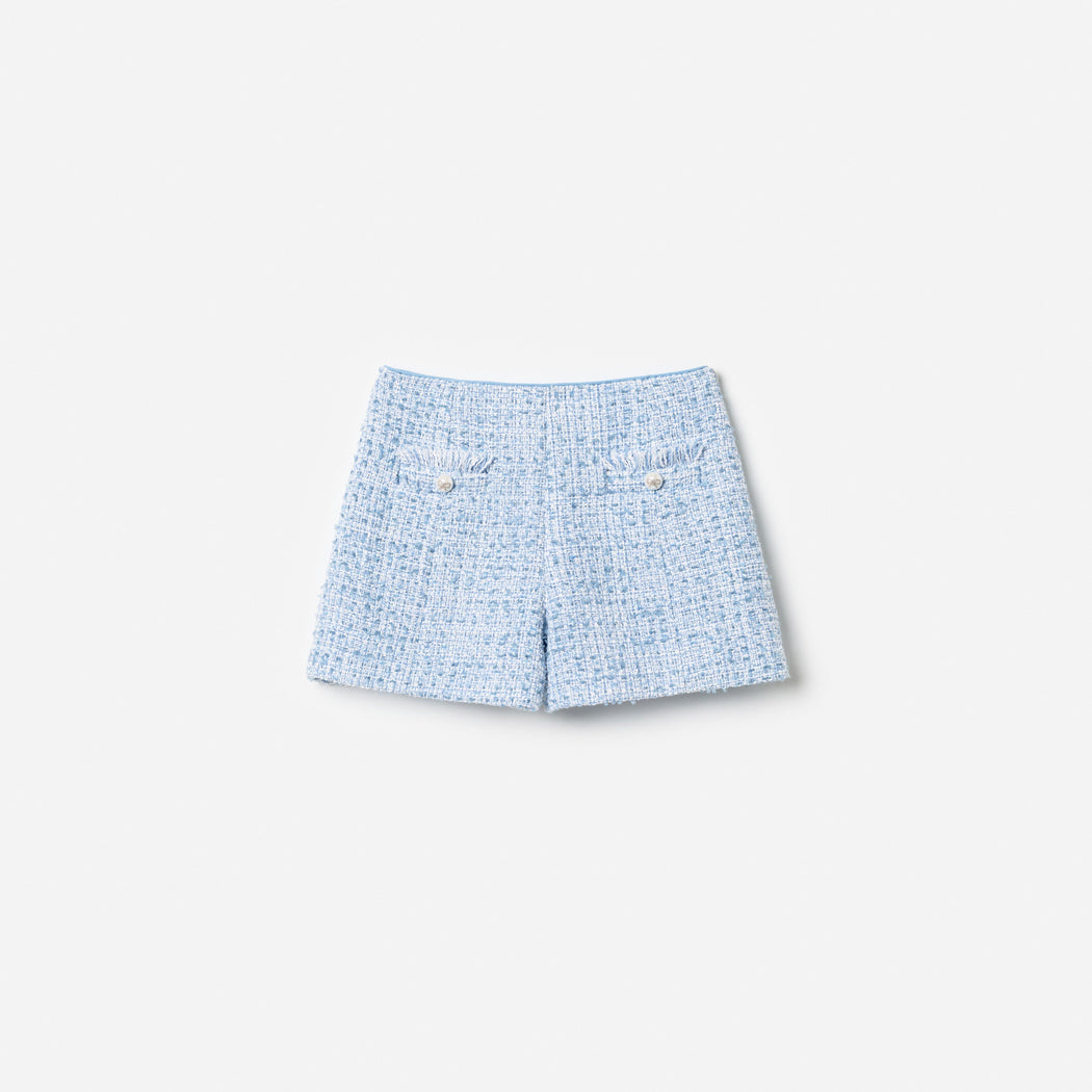 Front view of a girl wearing the Blue Textured Boucle Shorts