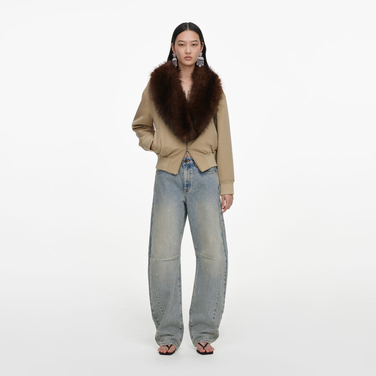Front view of a woman wearing the Bleached Wash Jeans