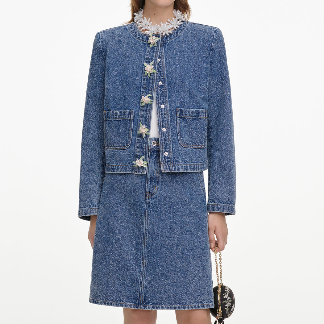 A close up of a woman wearing the Textured Denim Mini Skirt