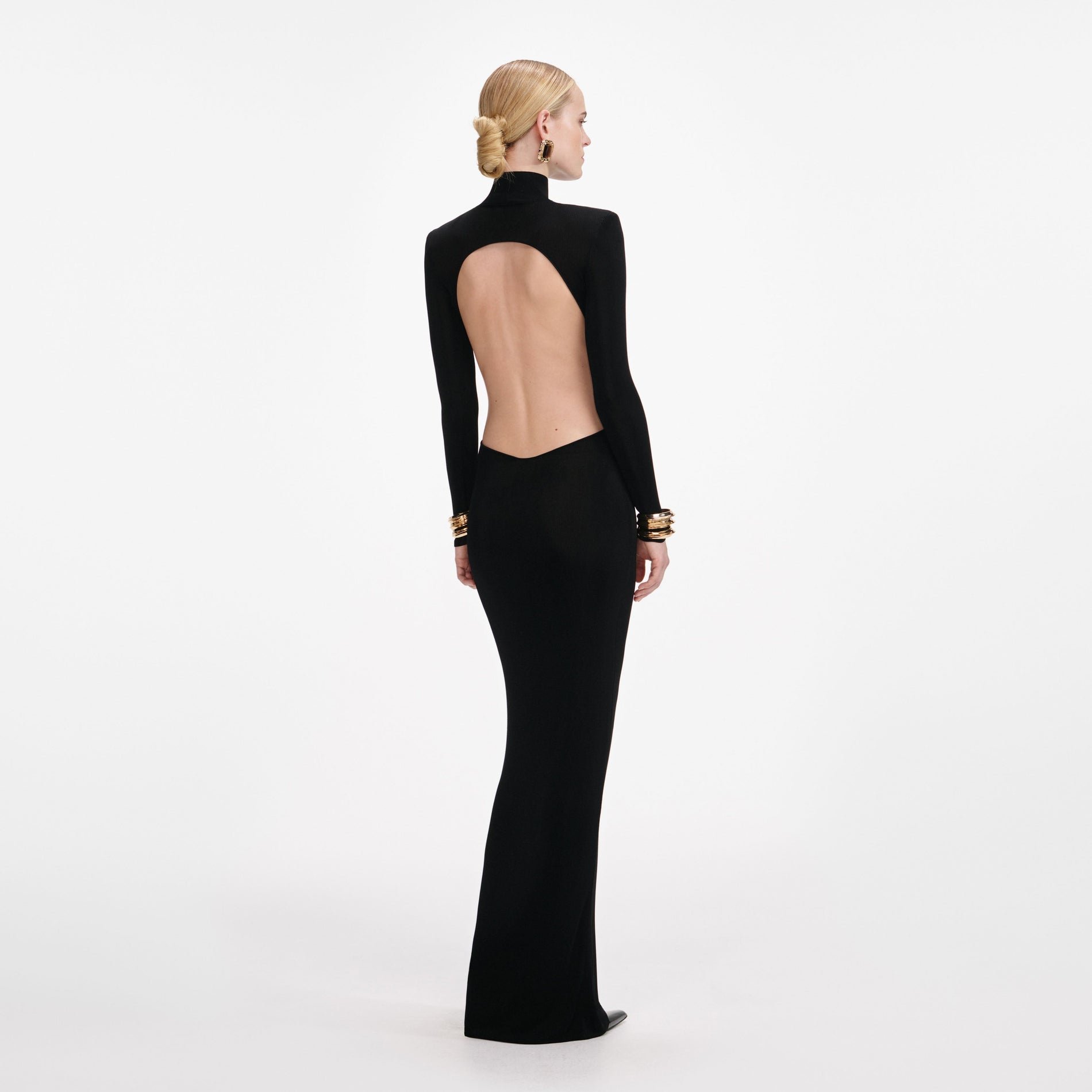Back view of a woman wearing the Black Viscose Knit Cut Out Maxi Dress