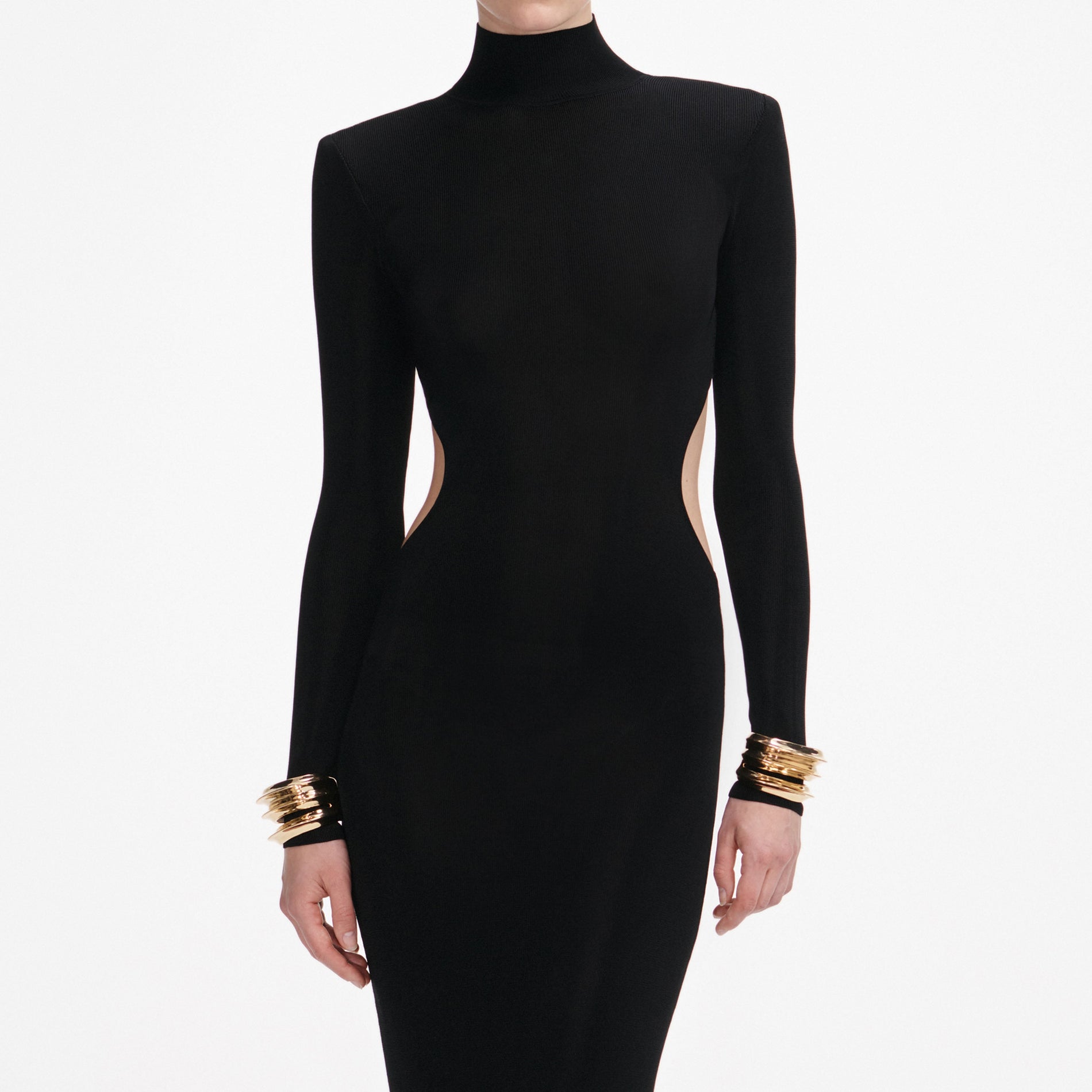 A close up of a woman wearing the Black Viscose Knit Cut Out Maxi Dress