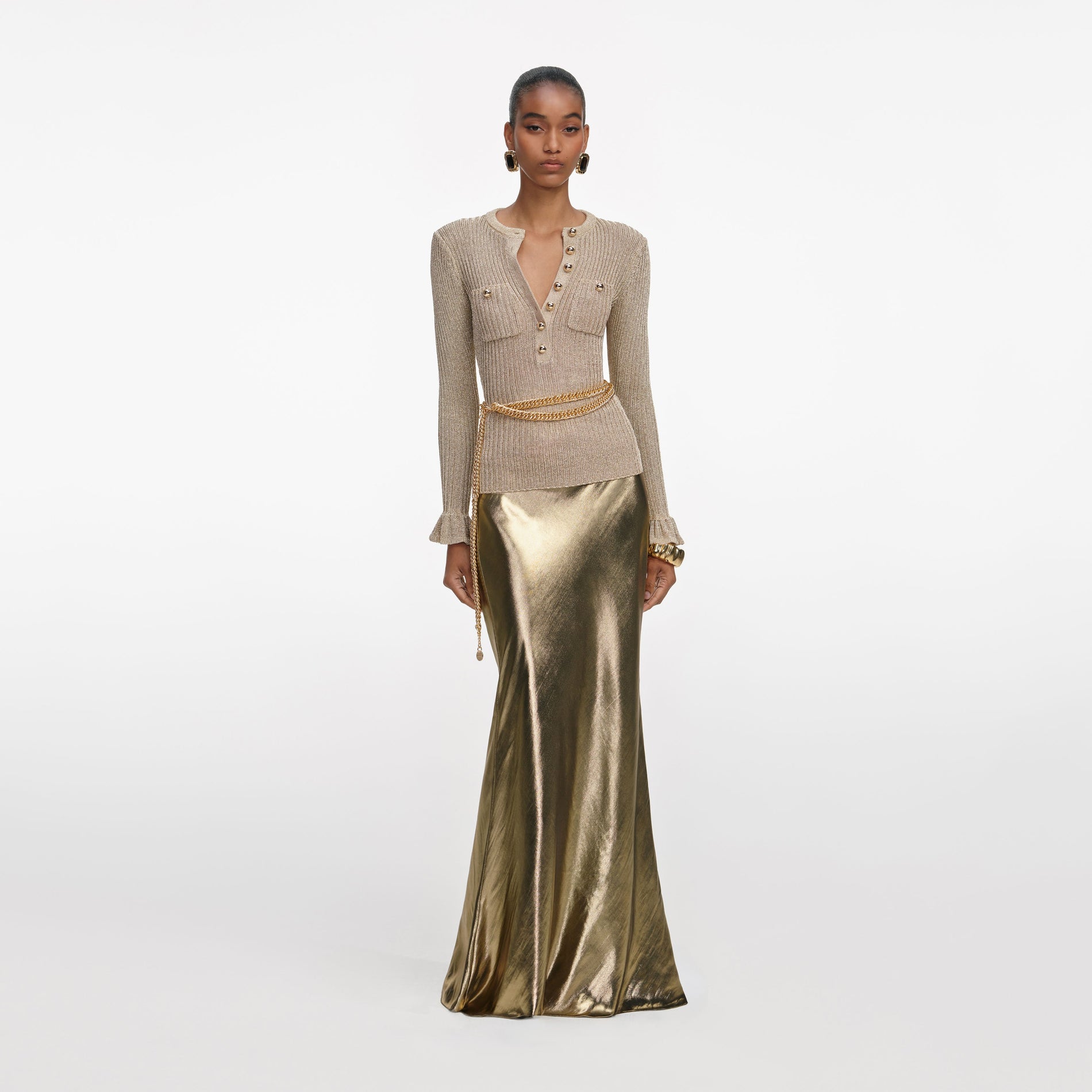 Front view of a woman wearing the Gold Metallic Maxi Skirt