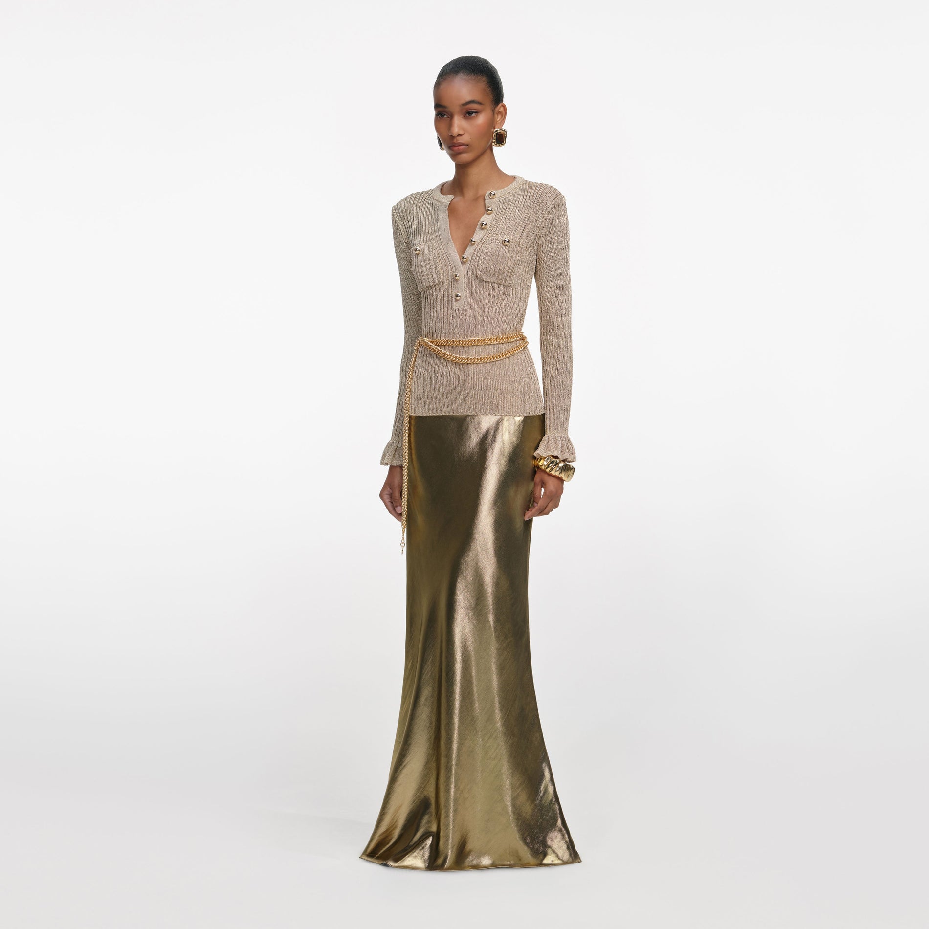 Side view of a woman wearing the Gold Lurex Ribbed Knit Top