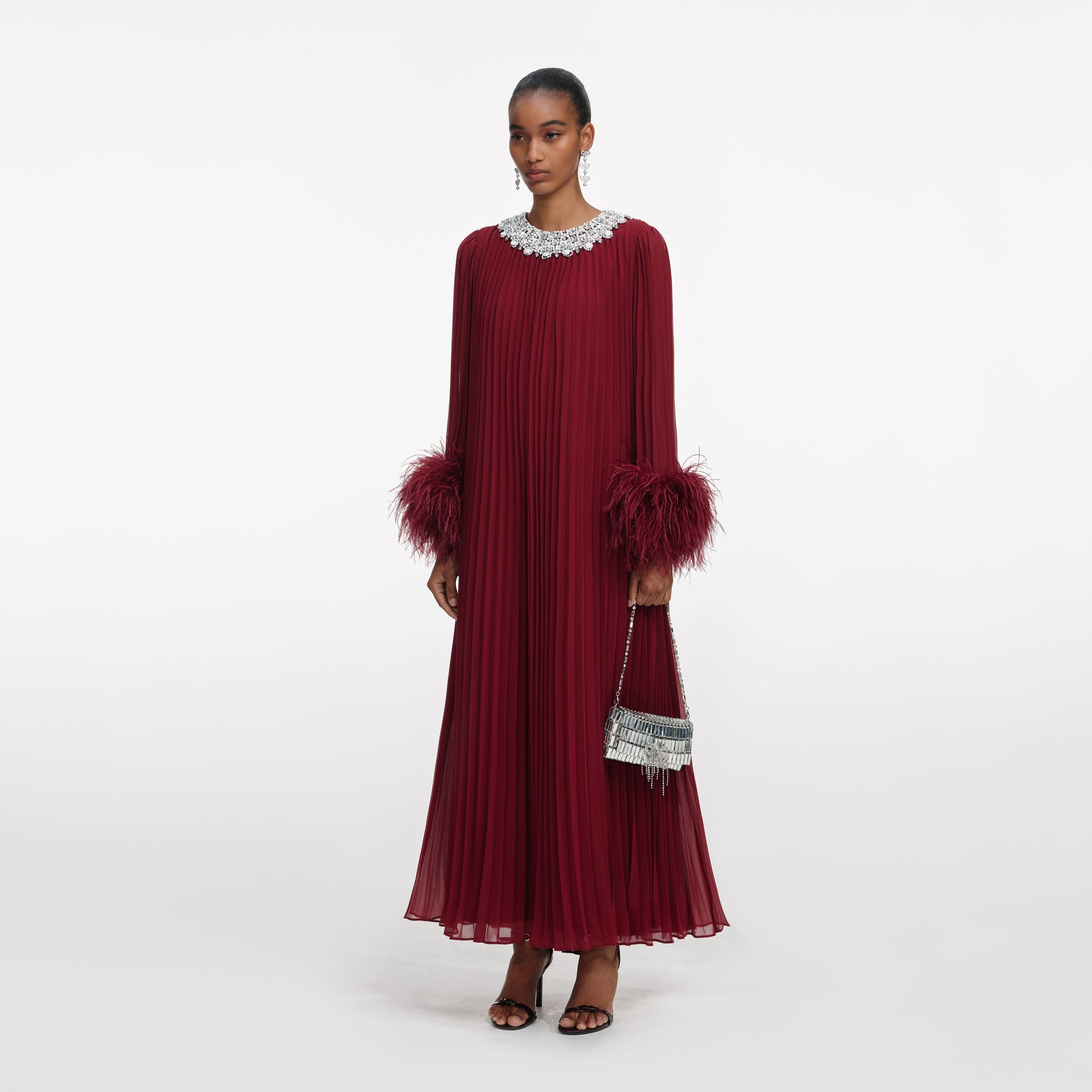 Side view of a woman wearing the Burgundy Chiffon Feather Midi Dress
