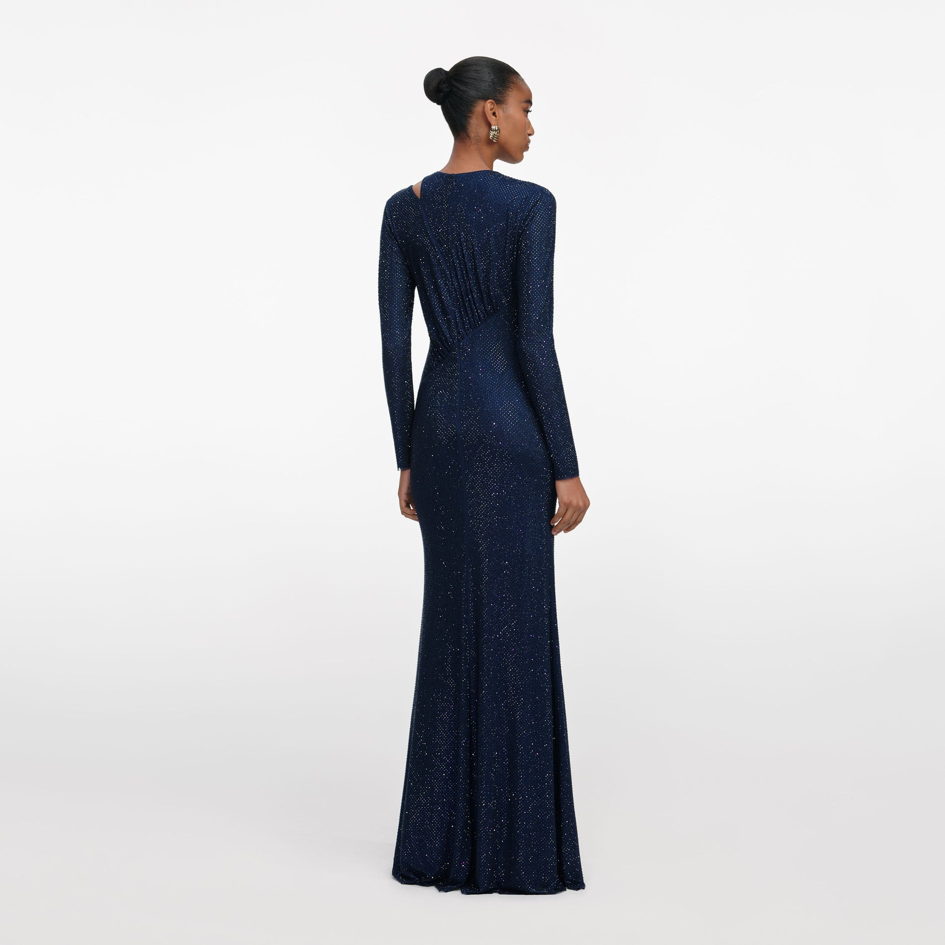 Back view of a woman wearing the Navy Rhinestone Mesh Cut Out Maxi Dress