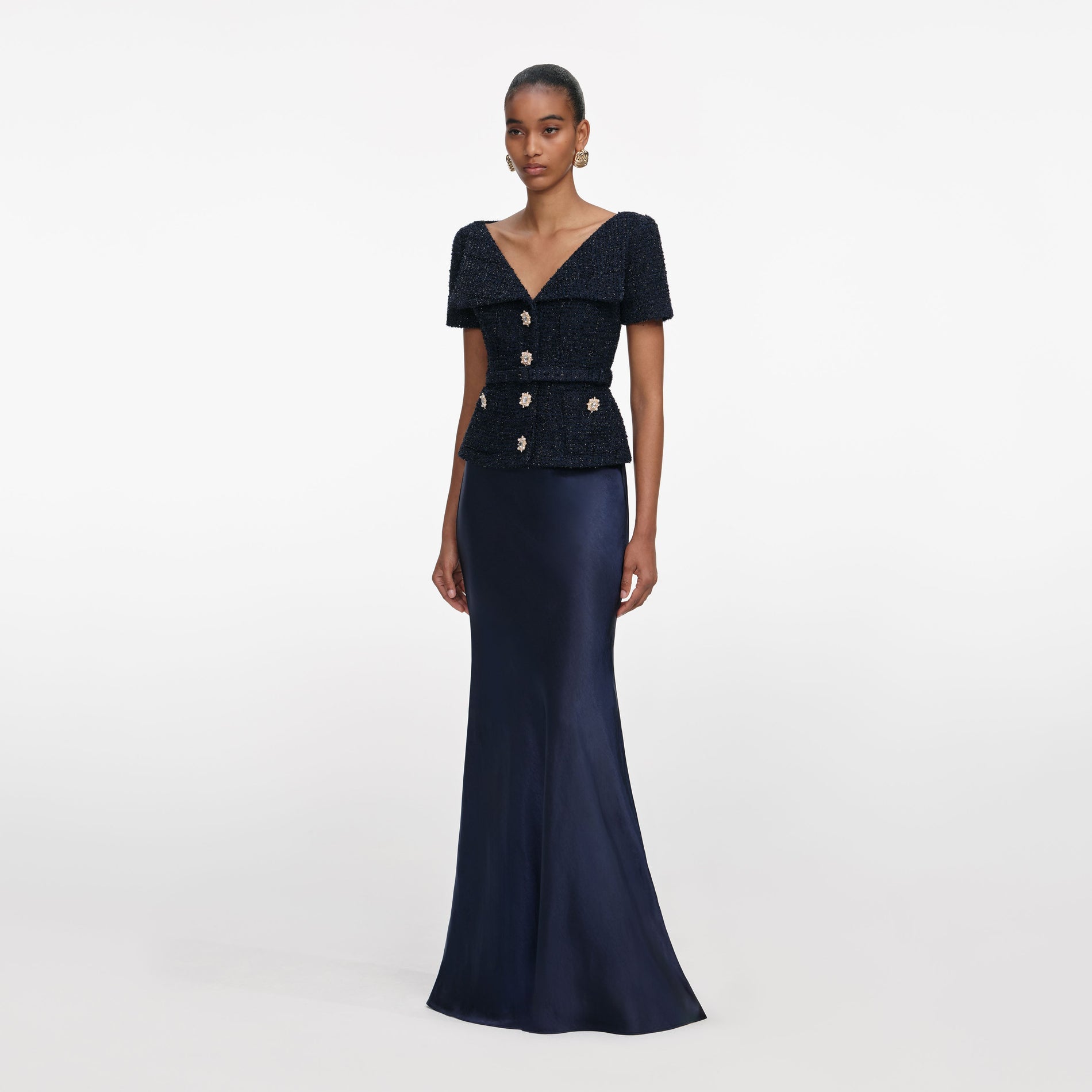 Side view of a woman wearing the Navy Boucle Tailored Maxi Dress
