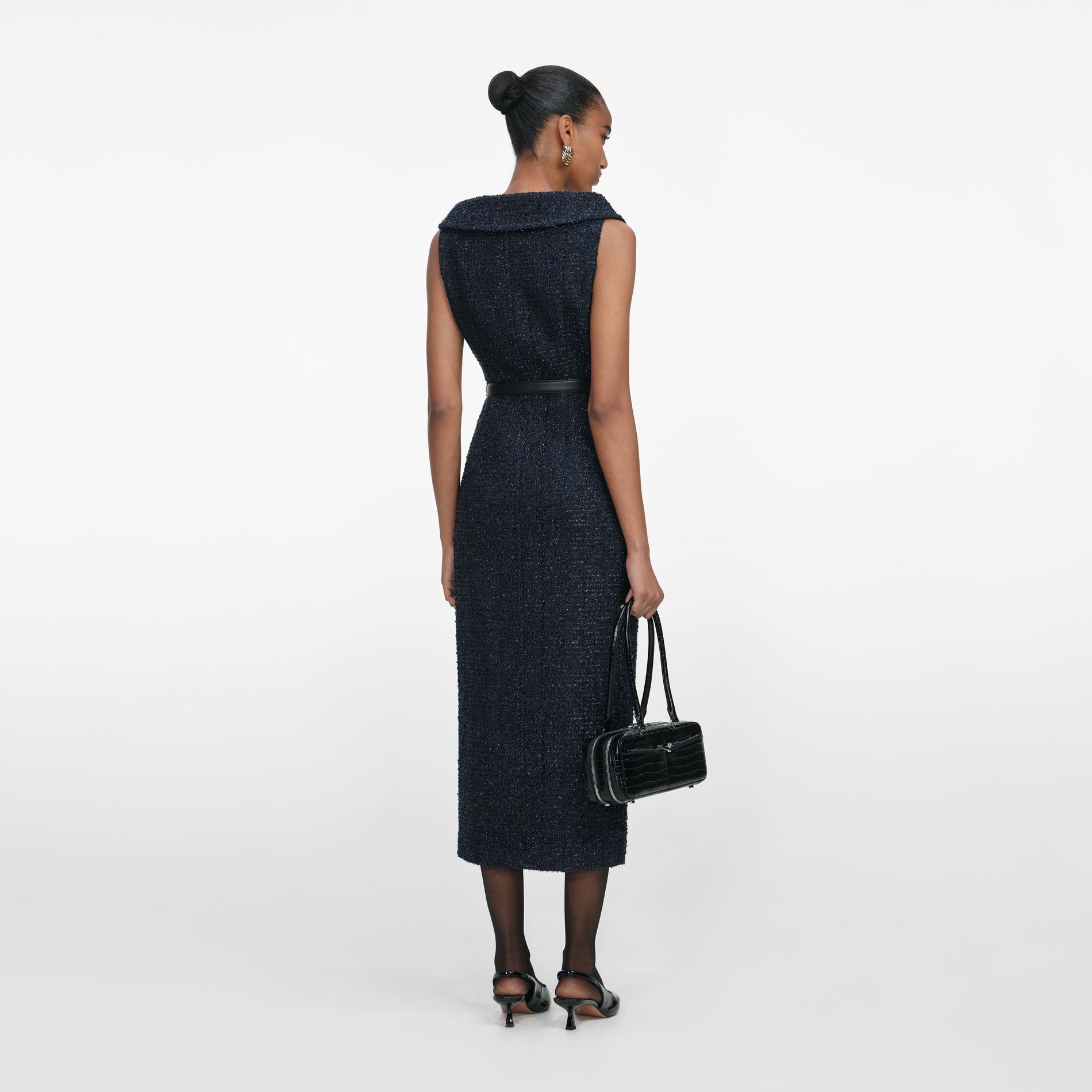 Back view of a woman wearing the Navy Boucle Midi Dress