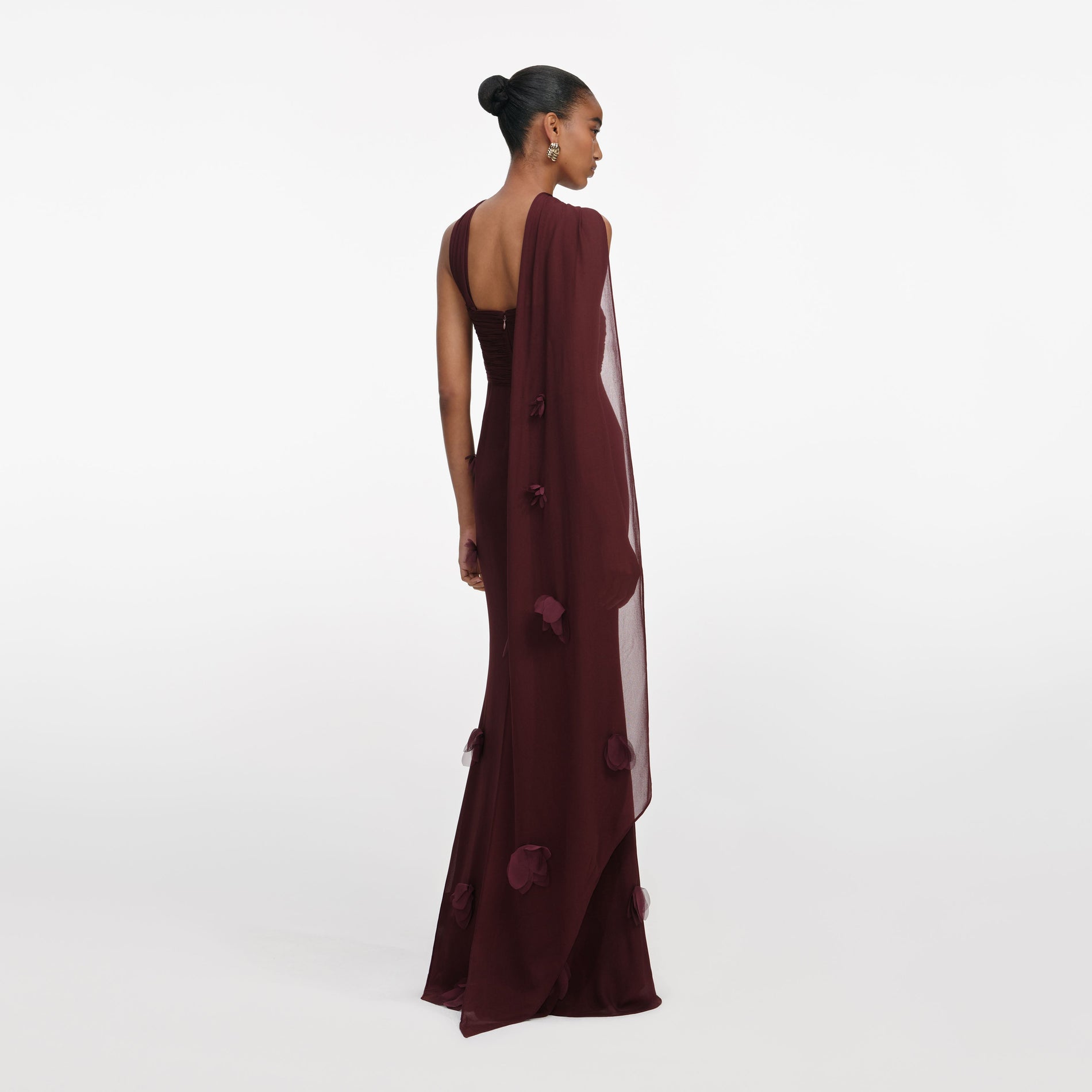 Back view of a woman wearing the Brown Georgette Flower Maxi Dress