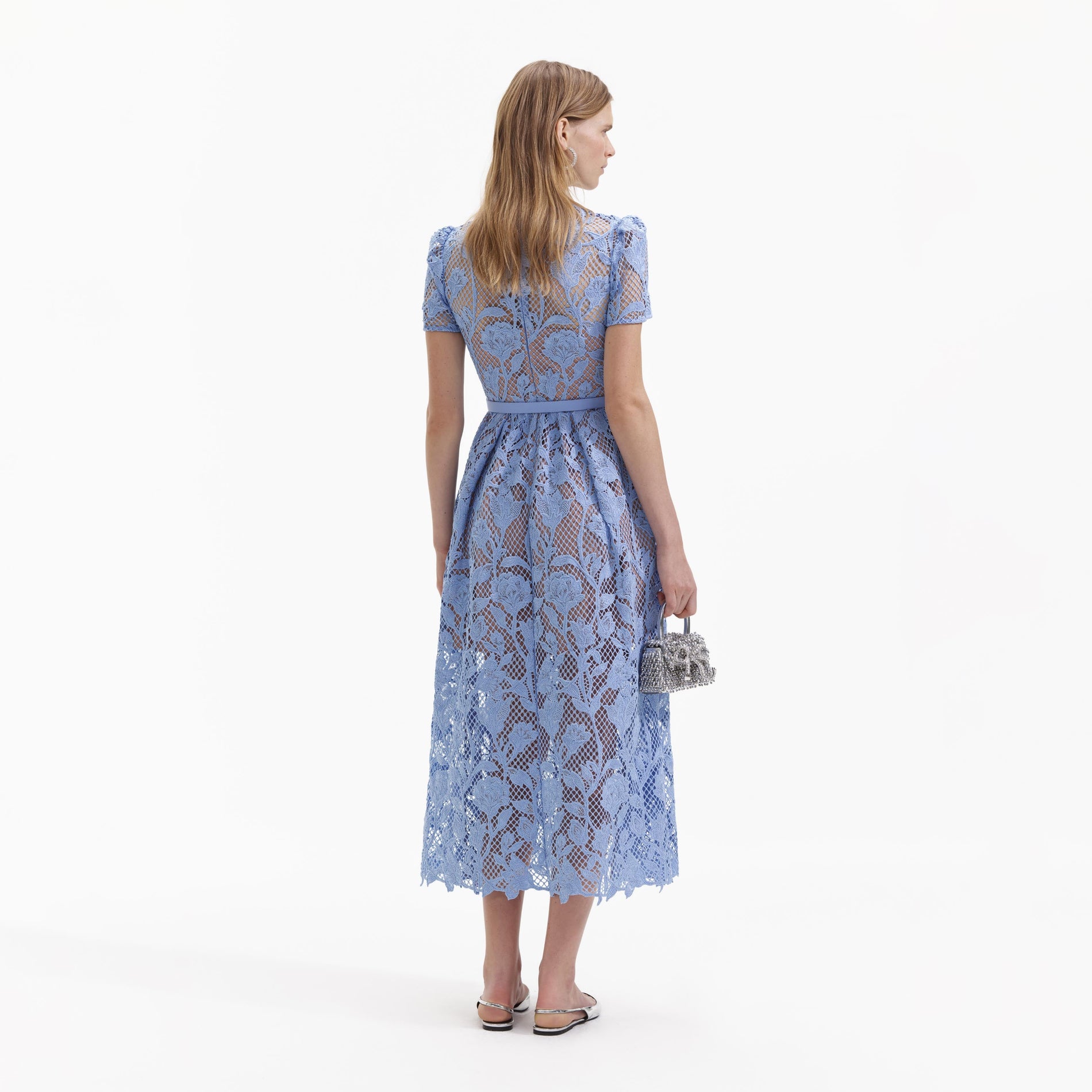 Back view of a woman wearing the Blue Lily Lace Midi Dress