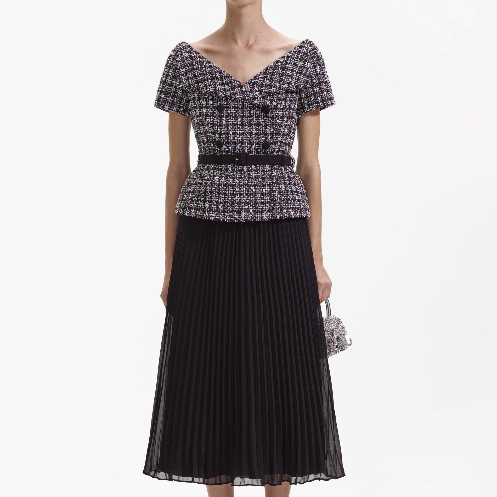 A close up of a woman wearing the Black Boucle Off Shoulder Midi Dress