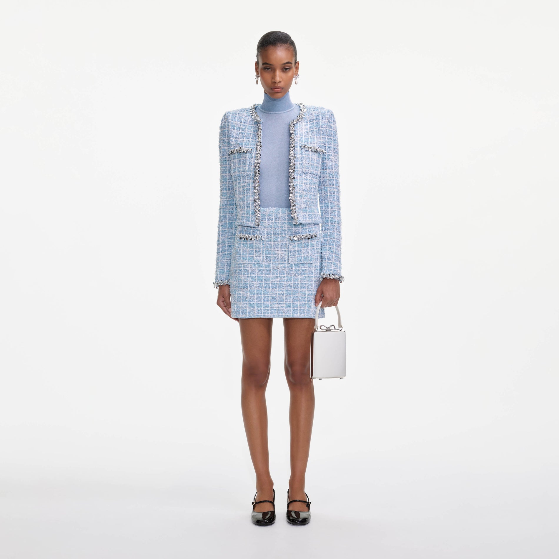 Front view of a woman wearing the Blue Check Cardigan